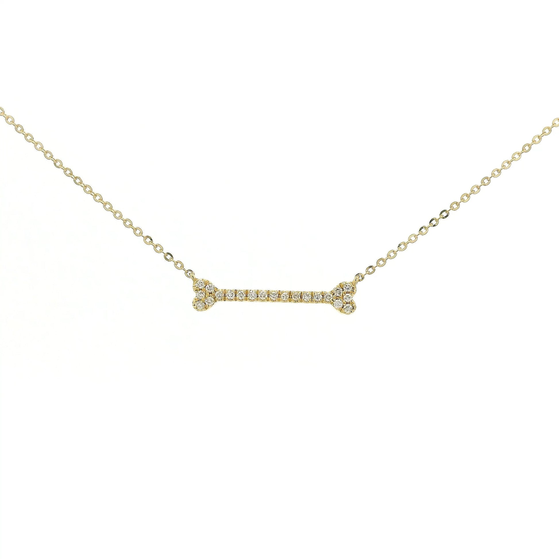 A Yellow Gold Dog Bone Pendant with diamonds at Forever Rox Fine Jewelry, Lake Tahoes Best Jewelry Store