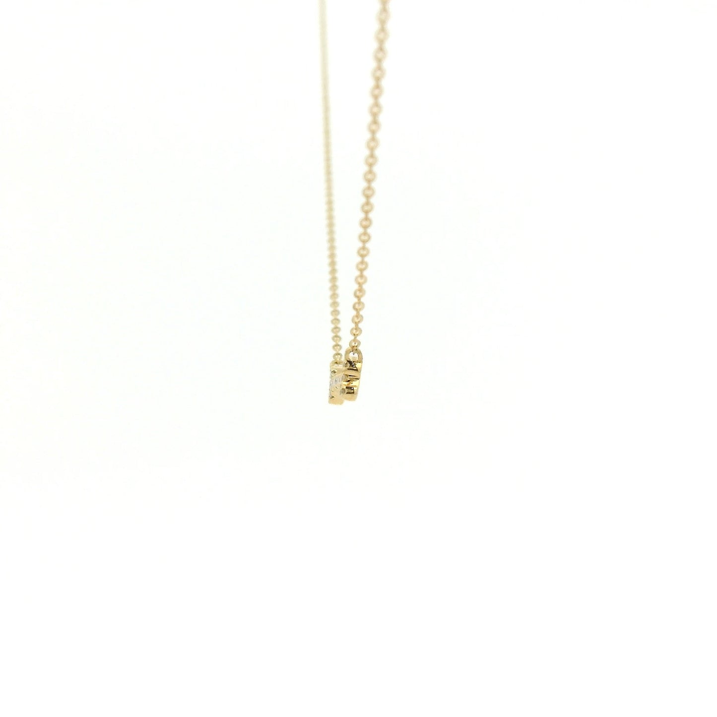 A Yellow Gold Dog Bone Pendant with diamonds at Forever Rox Fine Jewelry, Lake Tahoes Best Jewelry Store