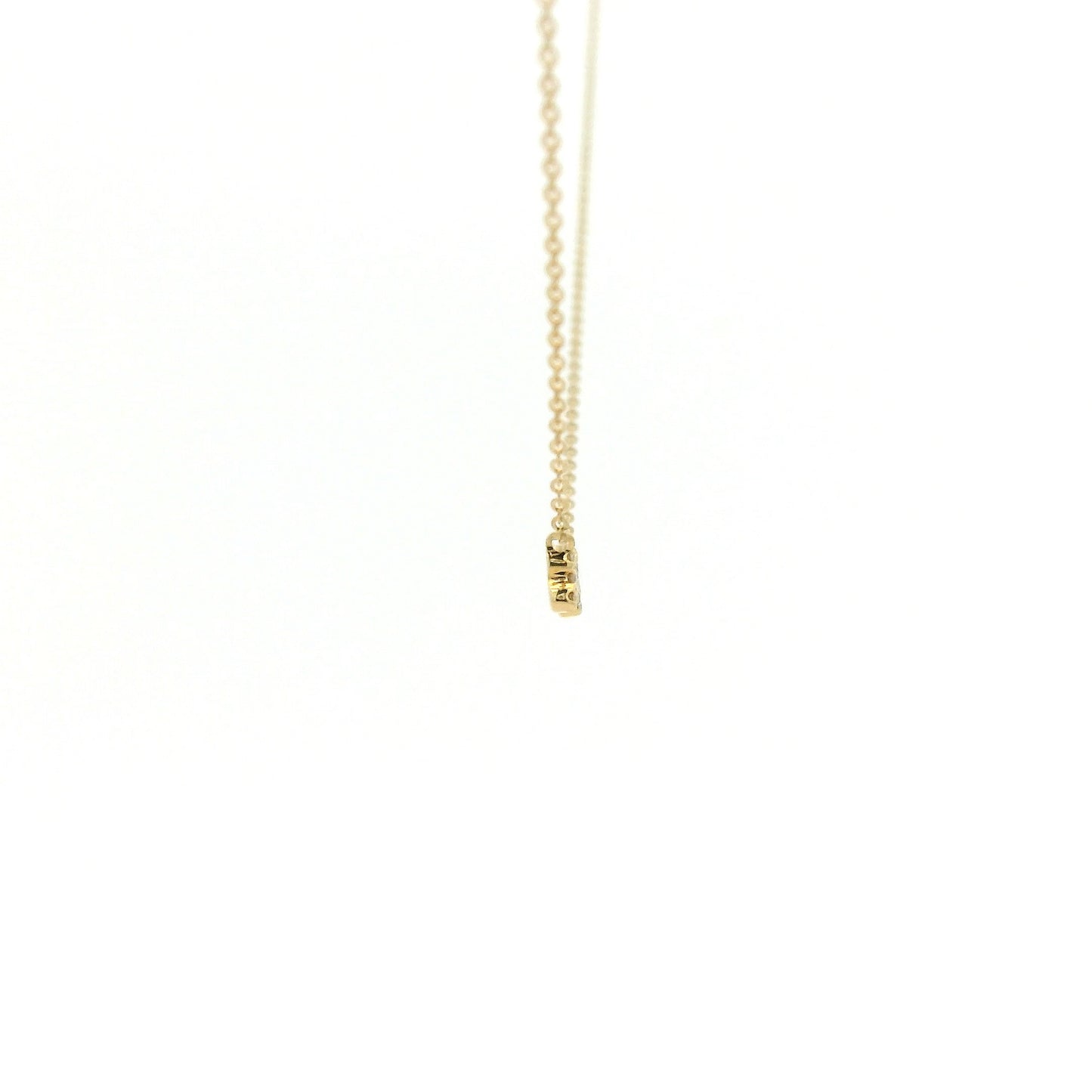 A Yellow Gold Dog Bone Pendant with diamonds at Forever Rox Fine Jewelry, Lake Tahoes Best Jewelry Store