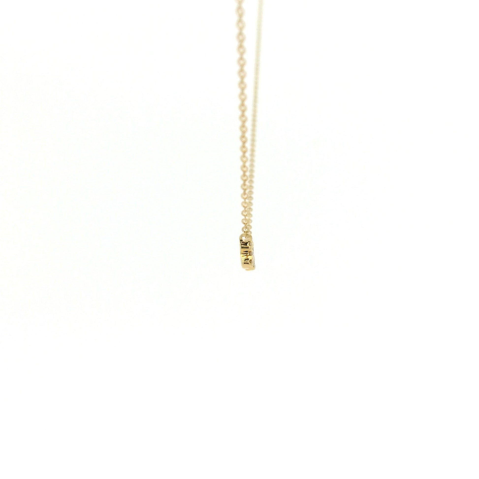 A Yellow Gold Dog Bone Pendant with diamonds at Forever Rox Fine Jewelry, Lake Tahoes Best Jewelry Store