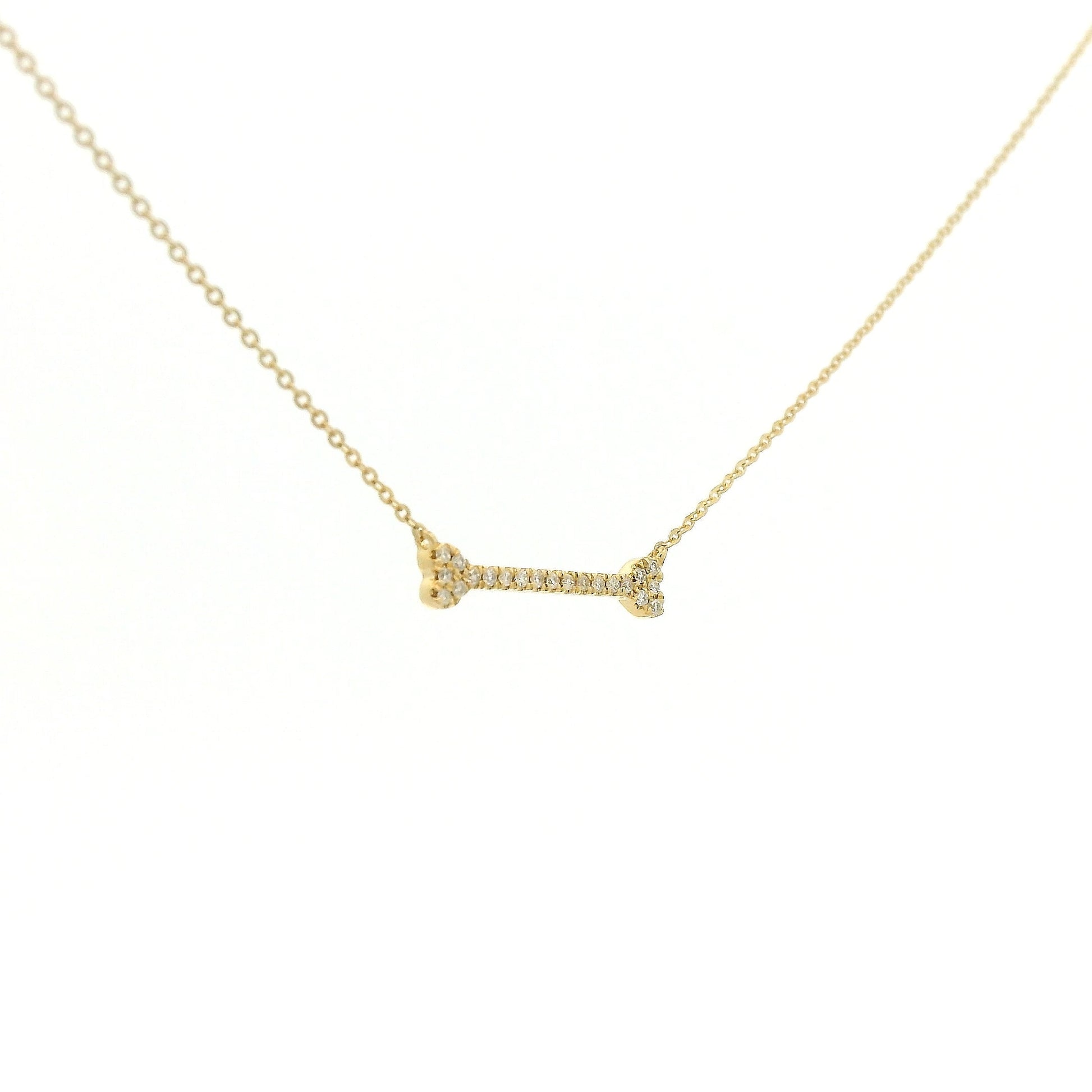 A Yellow Gold Dog Bone Pendant with diamonds at Forever Rox Fine Jewelry, Lake Tahoes Best Jewelry Store