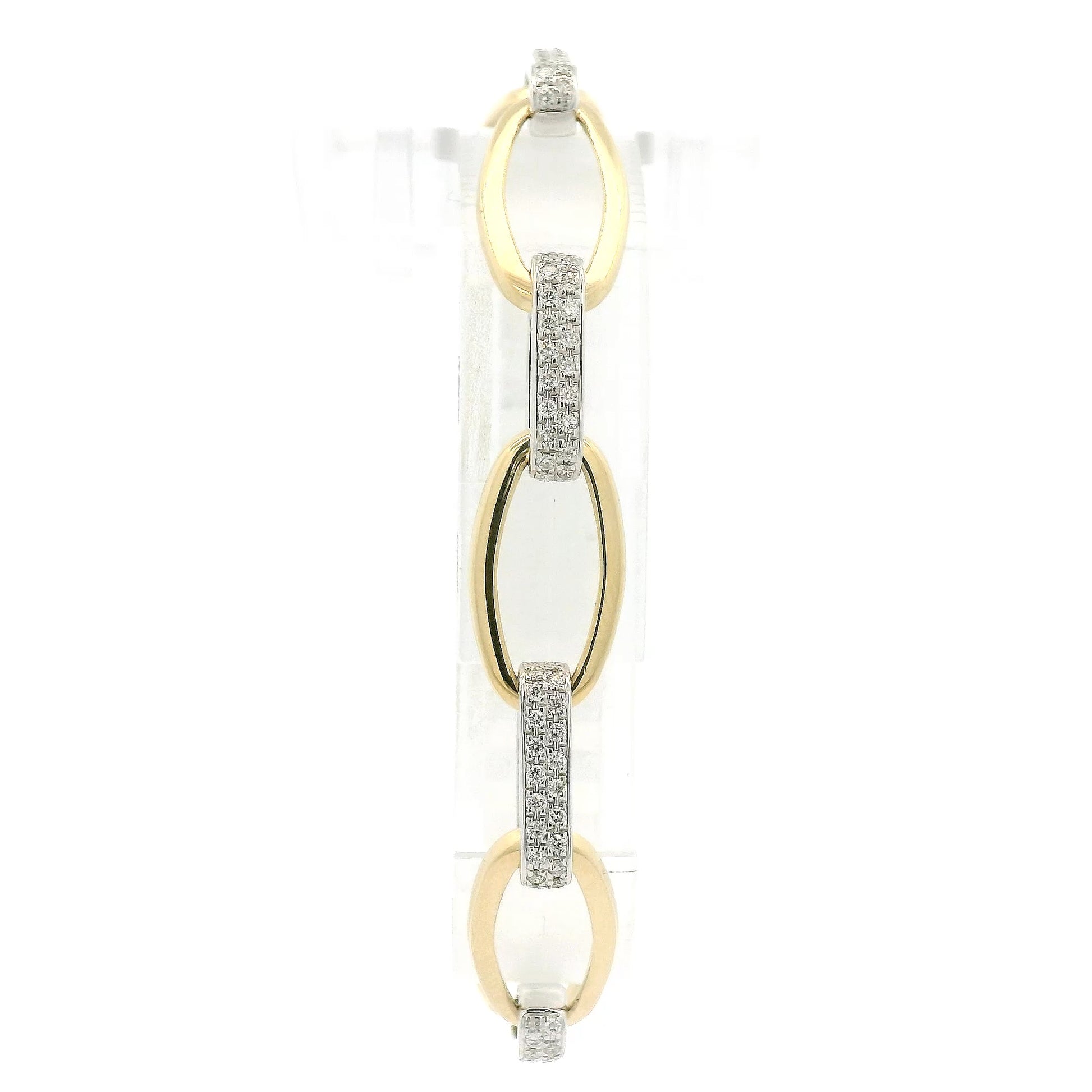 A Two Tone Gold Bracelet with a oval linkls and natural Diamond links alternating at Forever Rox Fine Jewelry, Lake Tahoes Best Jewelry Store