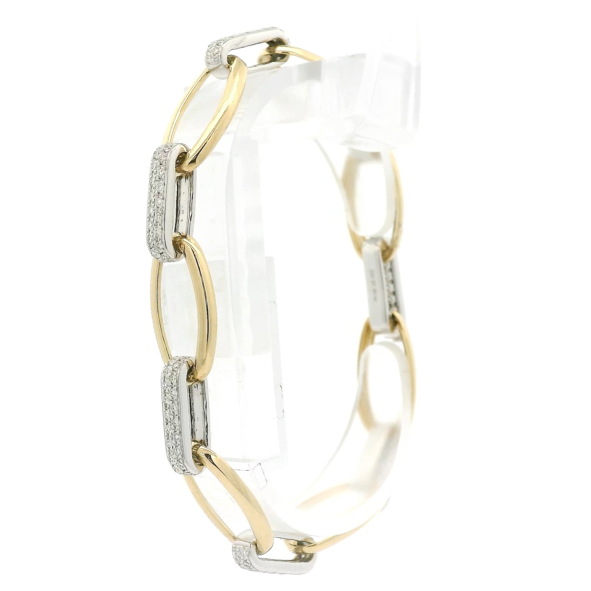A Two Tone Gold Bracelet with a oval linkls and natural Diamond links alternating at Forever Rox Fine Jewelry, Lake Tahoes Best Jewelry Store
