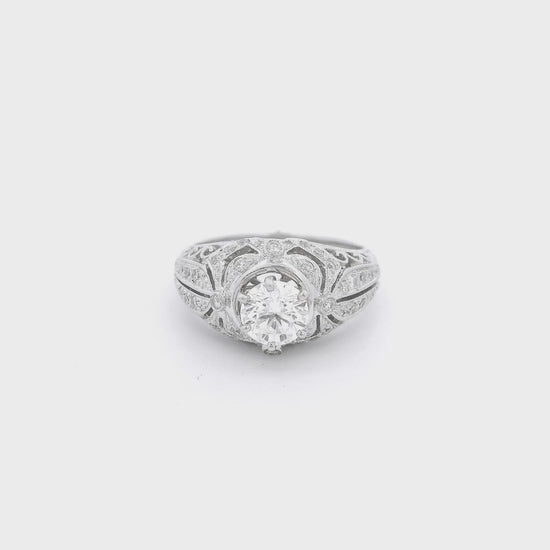 White Gold ring with a round cut diamond set in the cetner and some diamond accents on the filigree hand carved ring at Foreever Rox Fine Jewelry