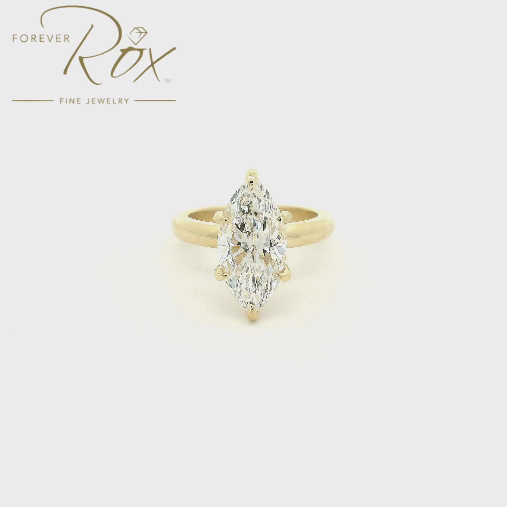 Designed with timeless simplicity in mind, this custom 14k yellow gold solitaire engagement ring showcases a breathtaking 3.07 carat marquise cut lab-grown diamond. Graded F color and VVS2 clarity, the elongated silhouette of the marquise cut creates an elegant, finger-lengthening appearance while maximizing brilliance and presence. The classic six-prong setting and softly rounded band allow the diamond to take center stage, proving that sometimes the most beautiful designs are the most timeless. Thoughtful