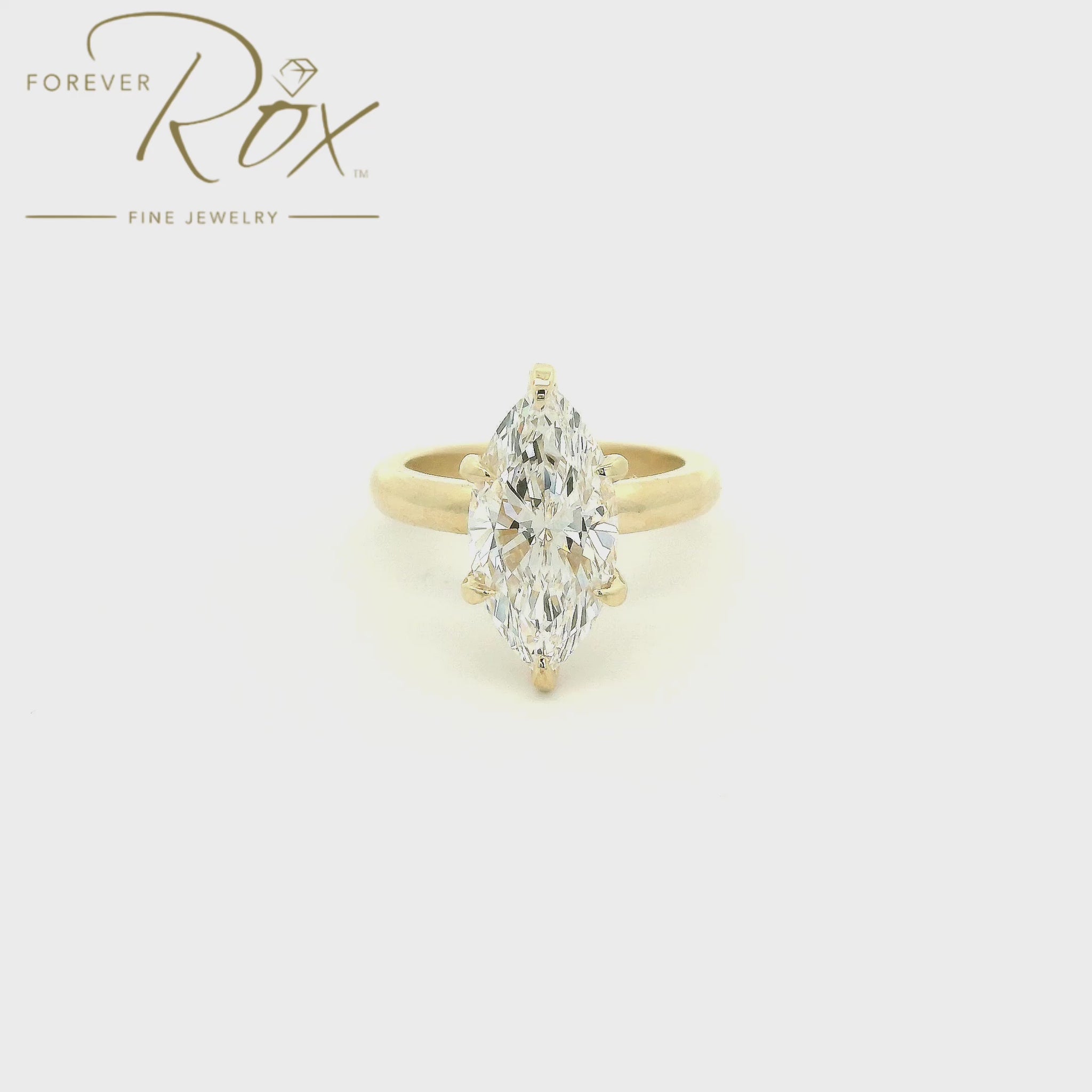 Designed with timeless simplicity in mind, this custom 14k yellow gold solitaire engagement ring showcases a breathtaking 3.07 carat marquise cut lab-grown diamond. Graded F color and VVS2 clarity, the elongated silhouette of the marquise cut creates an elegant, finger-lengthening appearance while maximizing brilliance and presence. The classic six-prong setting and softly rounded band allow the diamond to take center stage, proving that sometimes the most beautiful designs are the most timeless. Thoughtful