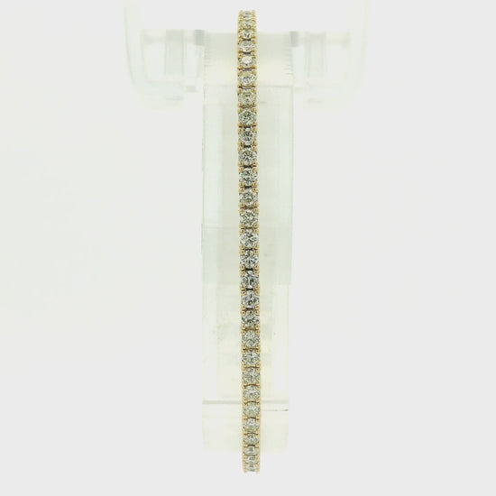 A Yellow Gold flex diamond bangle bracelet with diamonds all the way around at Forever Rox Fine Jewelry, Lake Tahoes Best Jewelry Store
