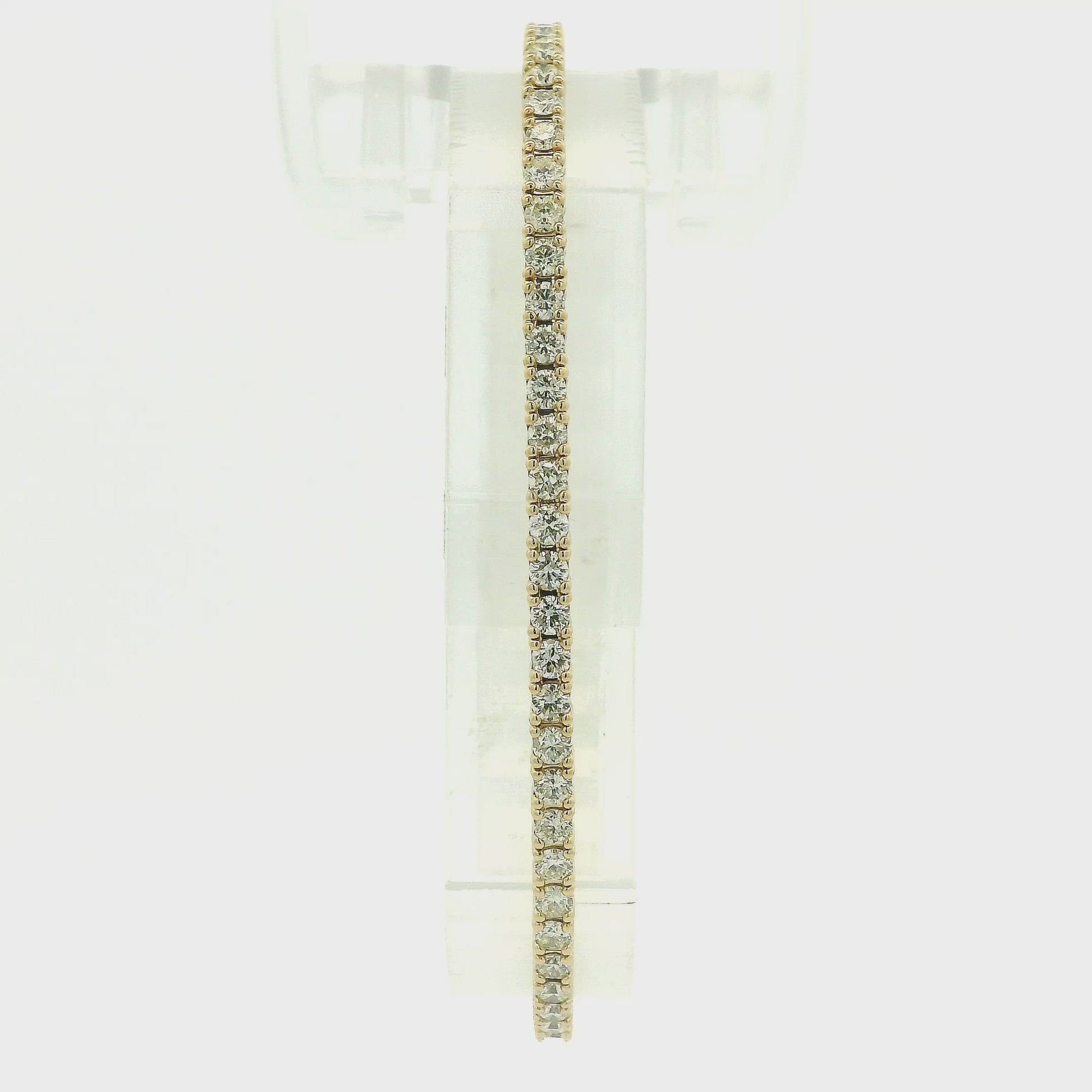 A Yellow Gold flex diamond bangle bracelet with diamonds all the way around at Forever Rox Fine Jewelry, Lake Tahoes Best Jewelry Store
