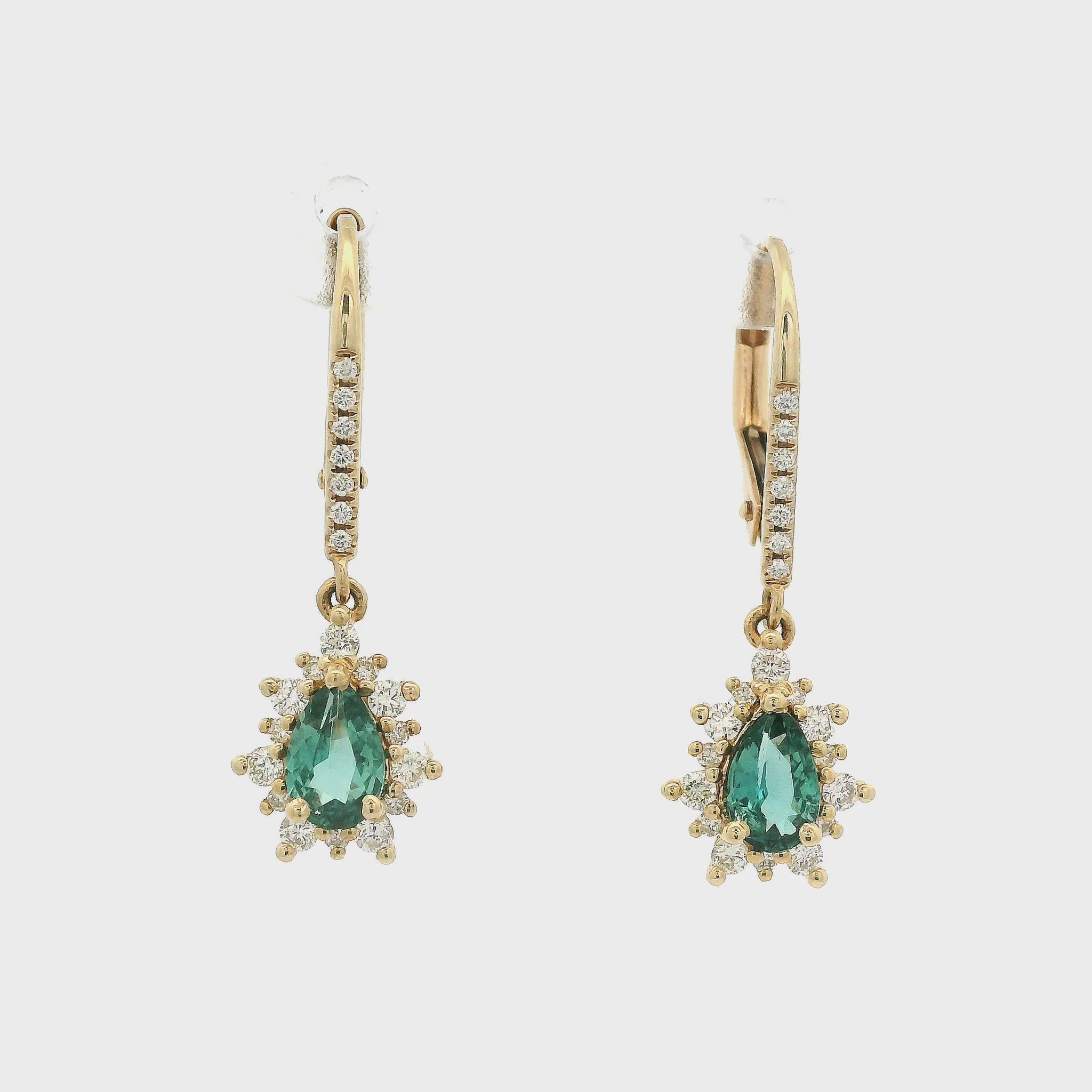 Pear Shape Alexandrites Set in Yellow Gold With Diamonds Dangling from Diamond Earrings Forever Rox Fine Jewelry
