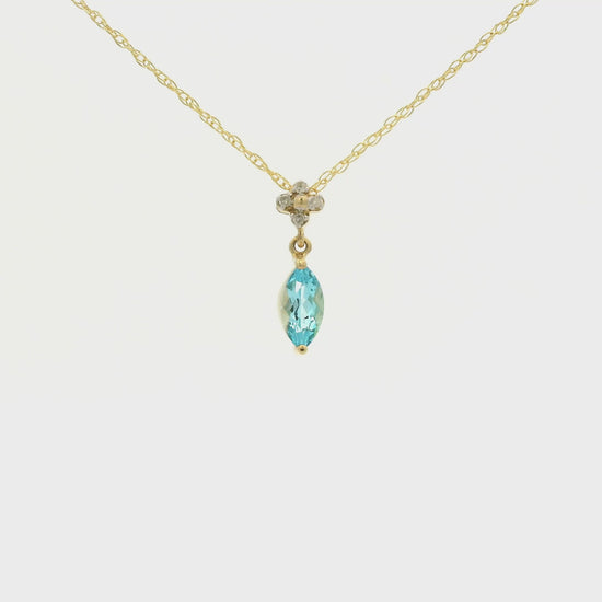 Yellow Gold Pendant with a prong set marquise cut natural Blue Topaz in the center with 4 diamonds at Forever Rox Fine Jewelry, Lake Tahoes Best Jewelry Store
