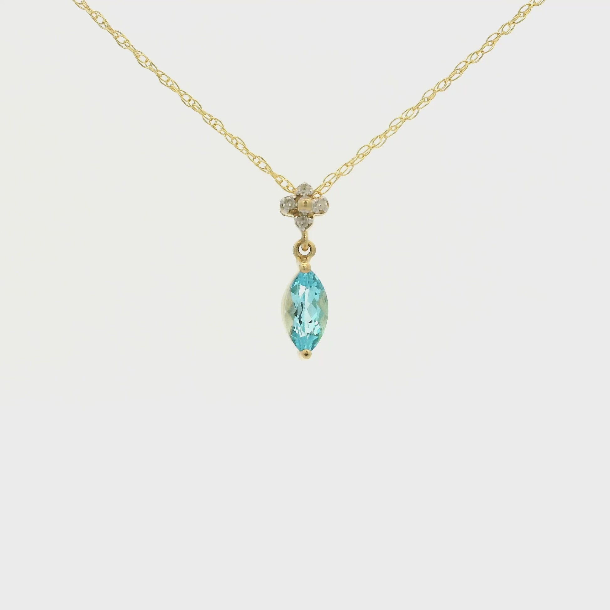 Yellow Gold Pendant with a prong set marquise cut natural Blue Topaz in the center with 4 diamonds at Forever Rox Fine Jewelry, Lake Tahoes Best Jewelry Store
