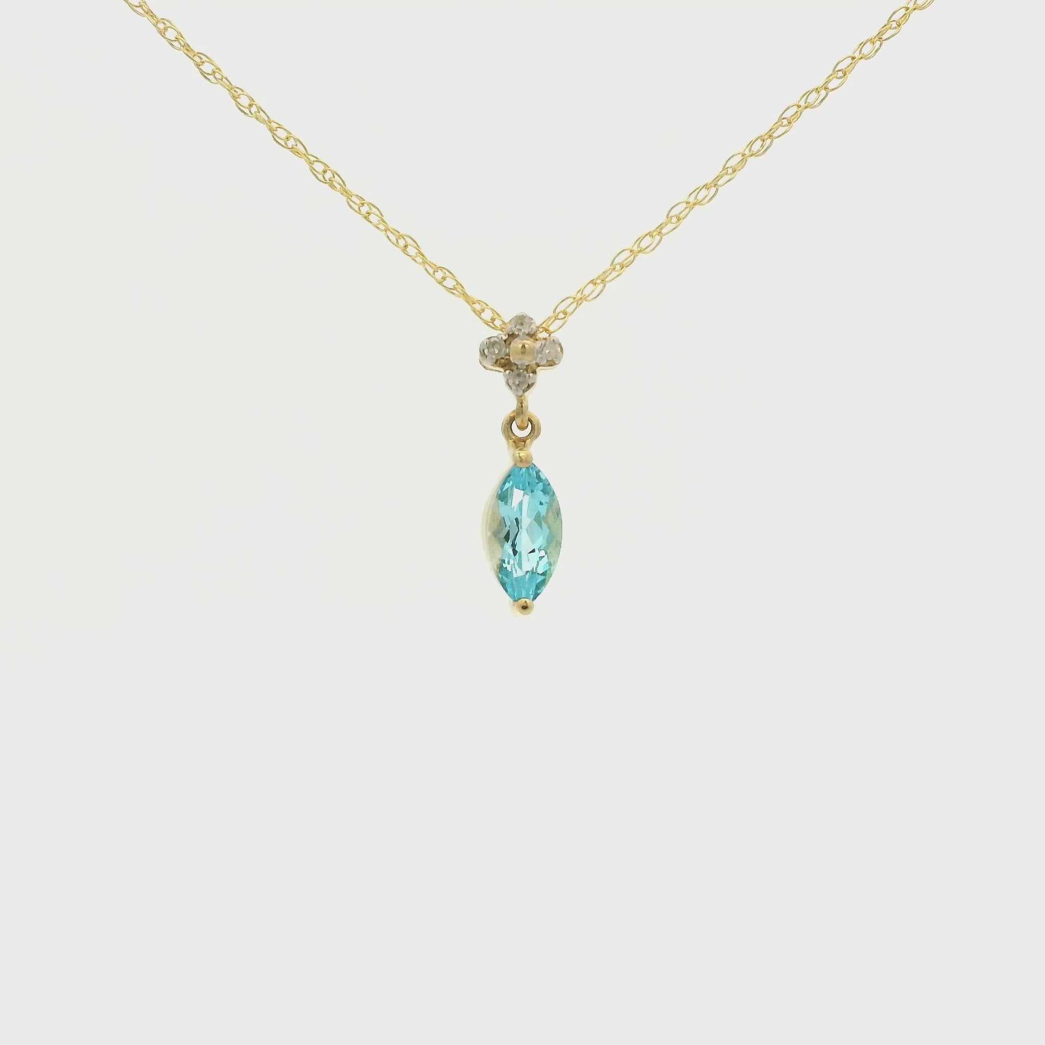 Yellow Gold Pendant with a prong set marquise cut natural Blue Topaz in the center with 4 diamonds at Forever Rox Fine Jewelry, Lake Tahoes Best Jewelry Store
