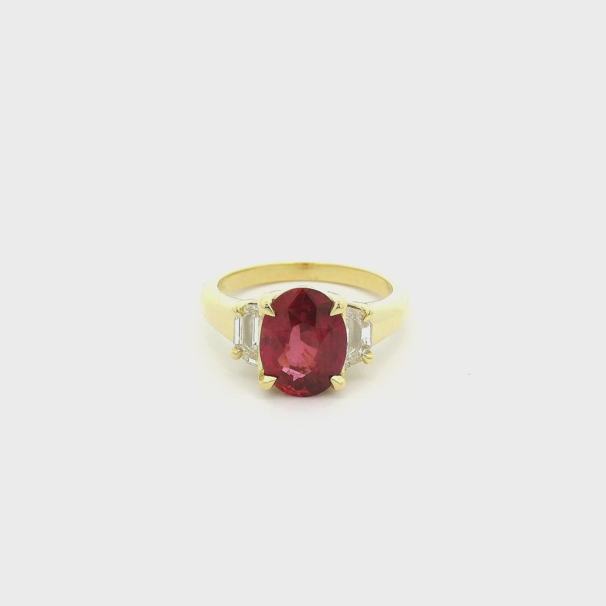 A Yellow Gold Ring with a prong set oval cut natural Certified No Heat Ruby in the center with two cadillac cut diamonds at Forever Rox Fine Jewelry, Lake Tahoes Best Jewelry Store
