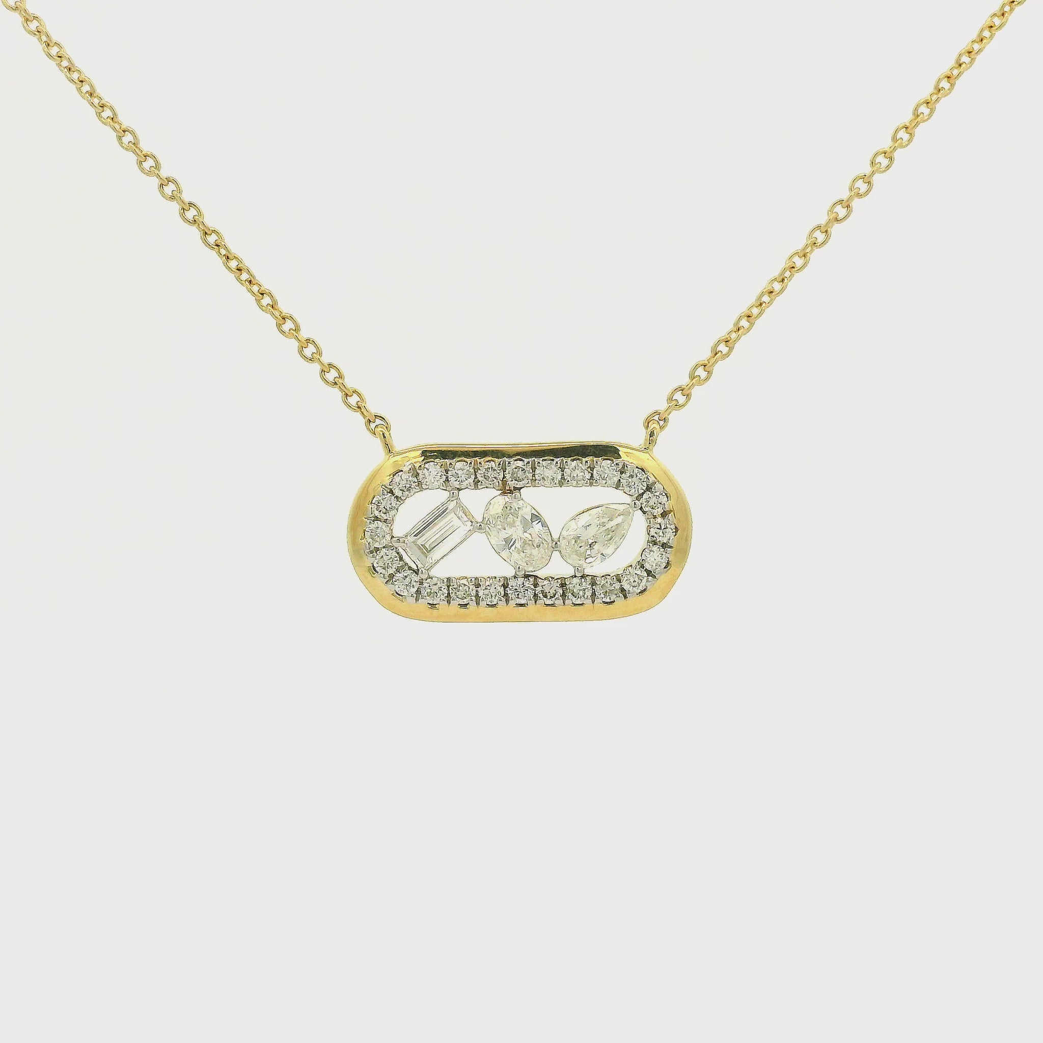 A Yellow Gold Pendant with Emerald, Pear, Oval & Round cut natural Diamonds with a chain attached at Forever Rox Fine Jewelry, Lake Tahoes Best Jewelry Store
