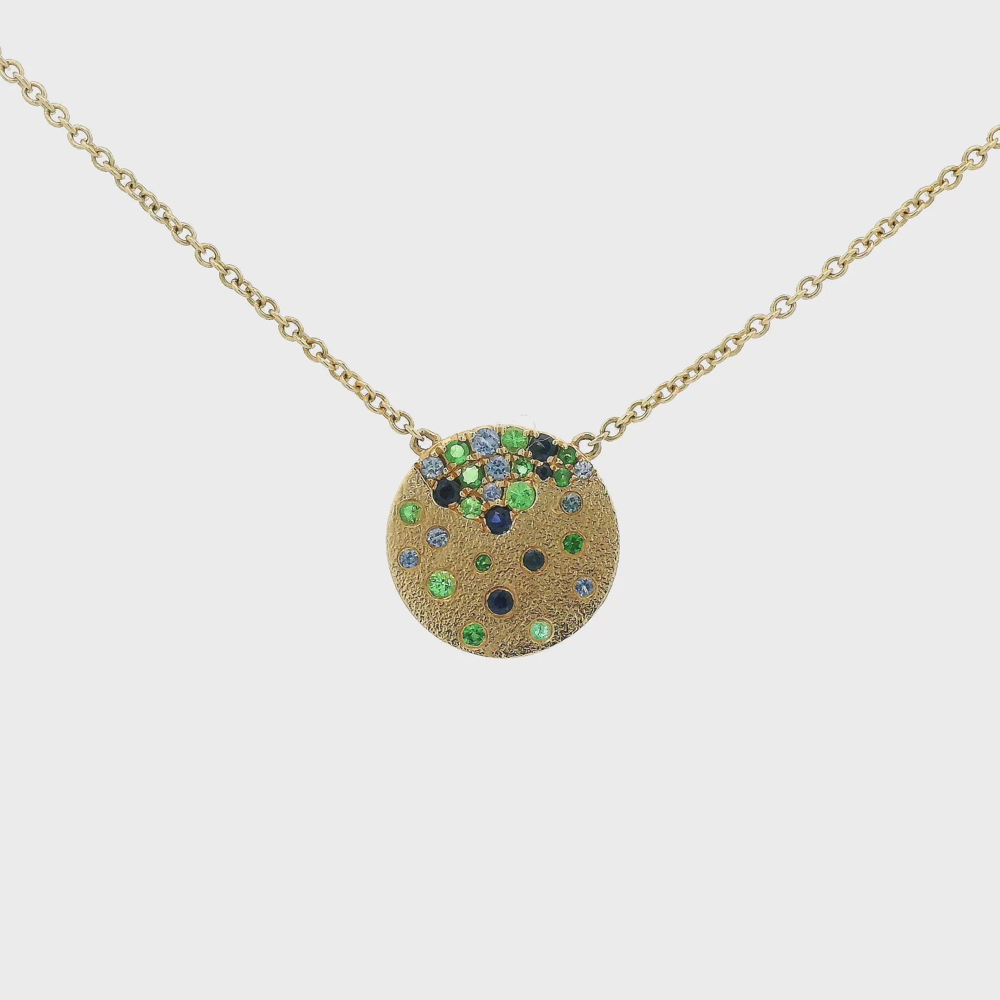 A Yellow Gold Pendant with flush set natural Sapphires & Tsavorites at Forever Rox Fine Jewelry, Lake Tahoes Best Jewelry Store