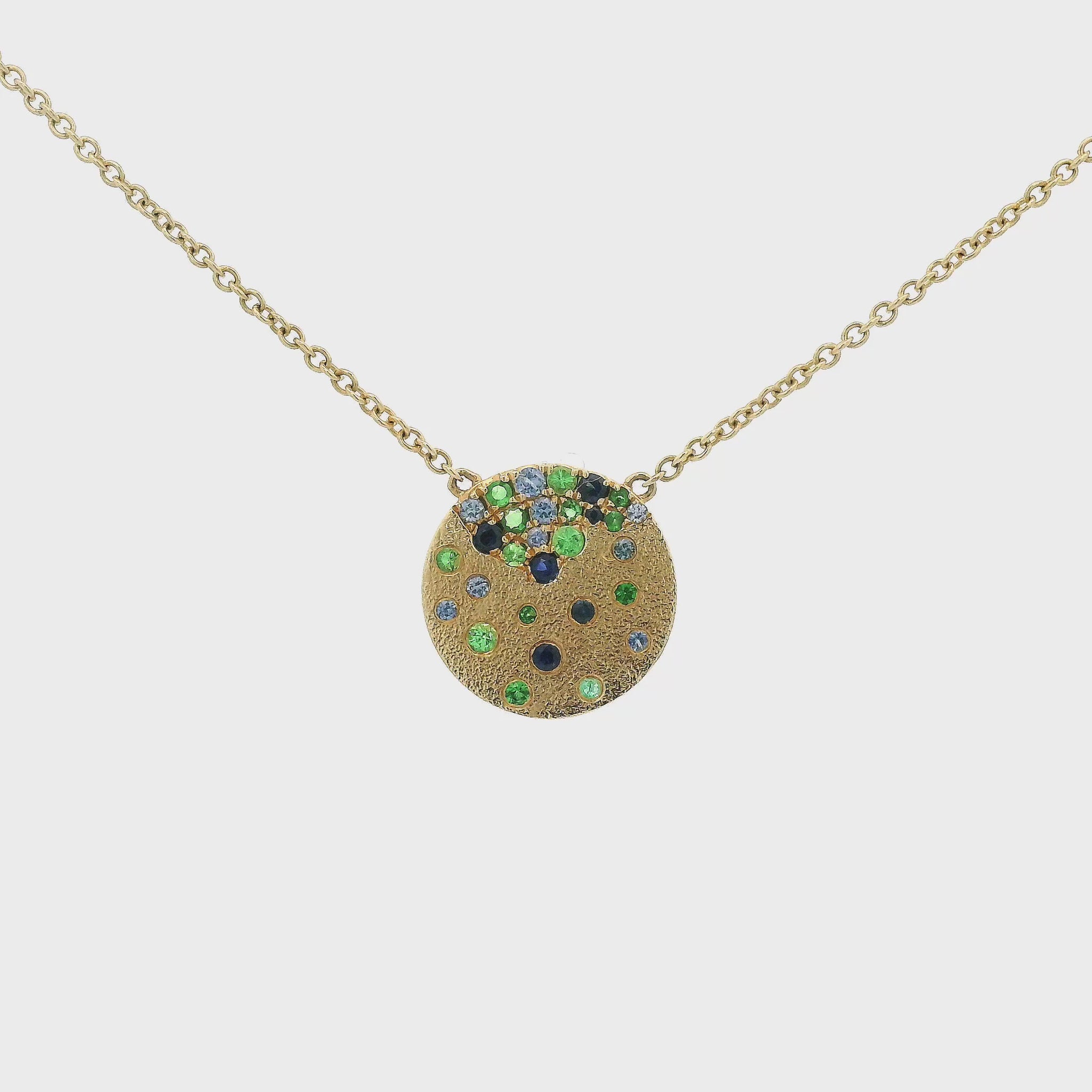 A Yellow Gold Pendant with flush set natural Sapphires & Tsavorites at Forever Rox Fine Jewelry, Lake Tahoes Best Jewelry Store
