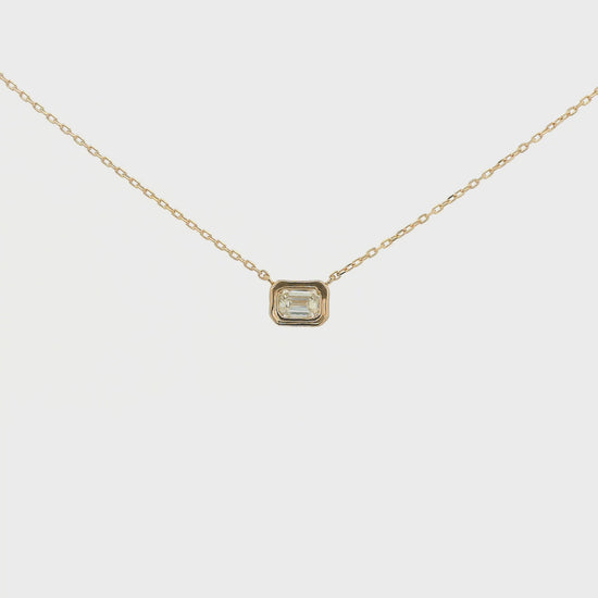 A Rose Gold Pendant with a bezel set emerald cut natural Diamond in the center at Forever Rox Fine Jewelry, Lake Tahoes Best Jewelry Store
