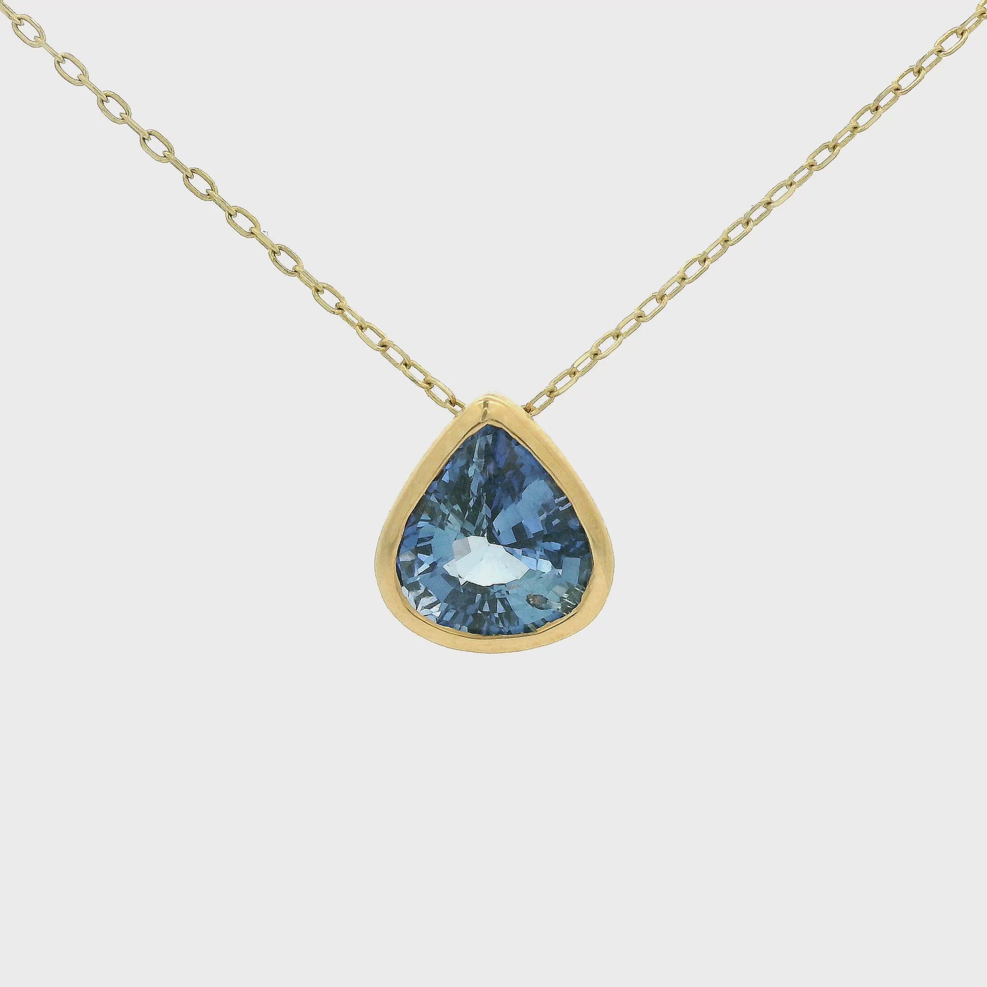 Pear Shape Ceylonesse Sapphire Pendant Set in a yellow gold bezel pendant at Forever Rox Fine Jewelry