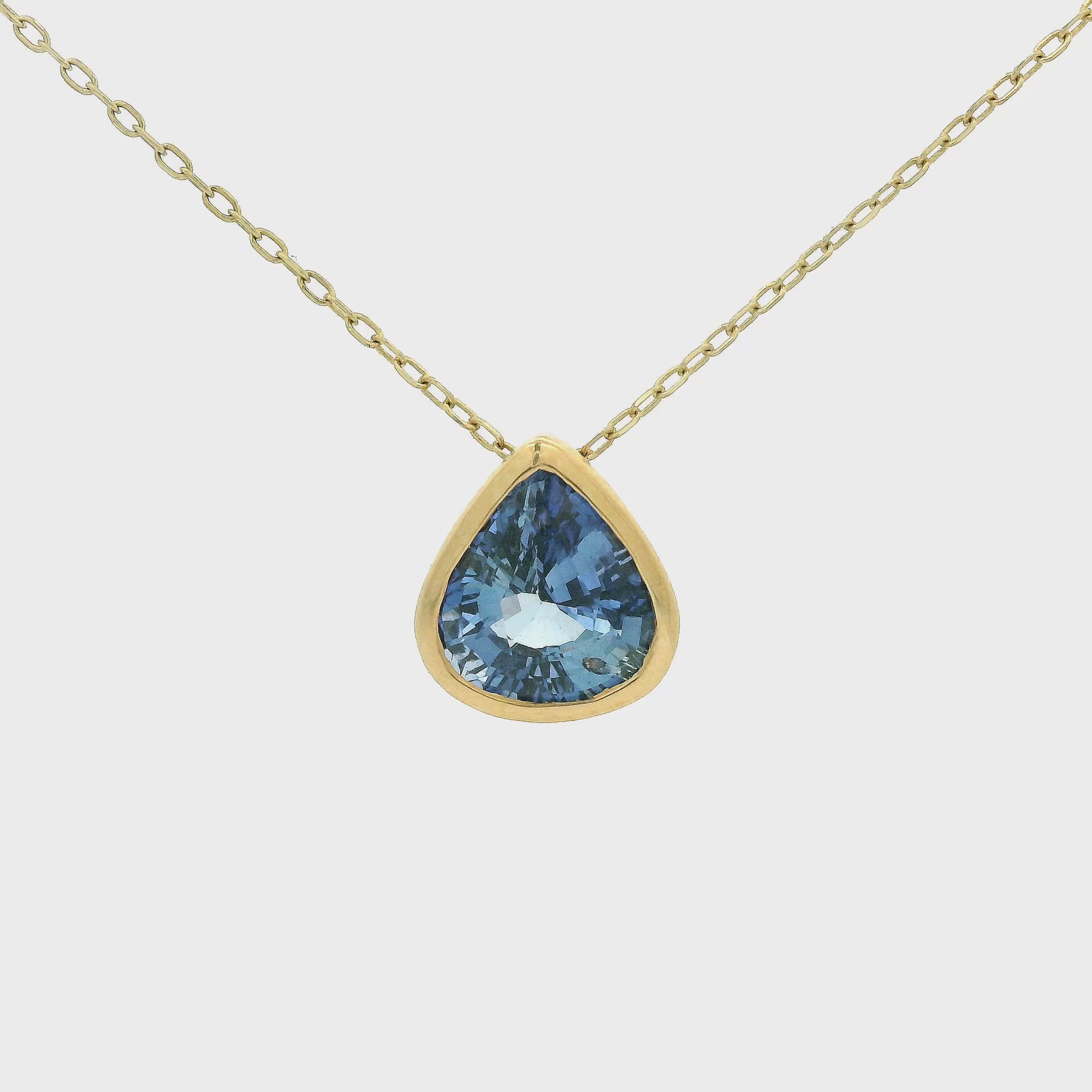Pear Shape Ceylonesse Sapphire Pendant Set in a yellow gold bezel pendant at Forever Rox Fine Jewelry