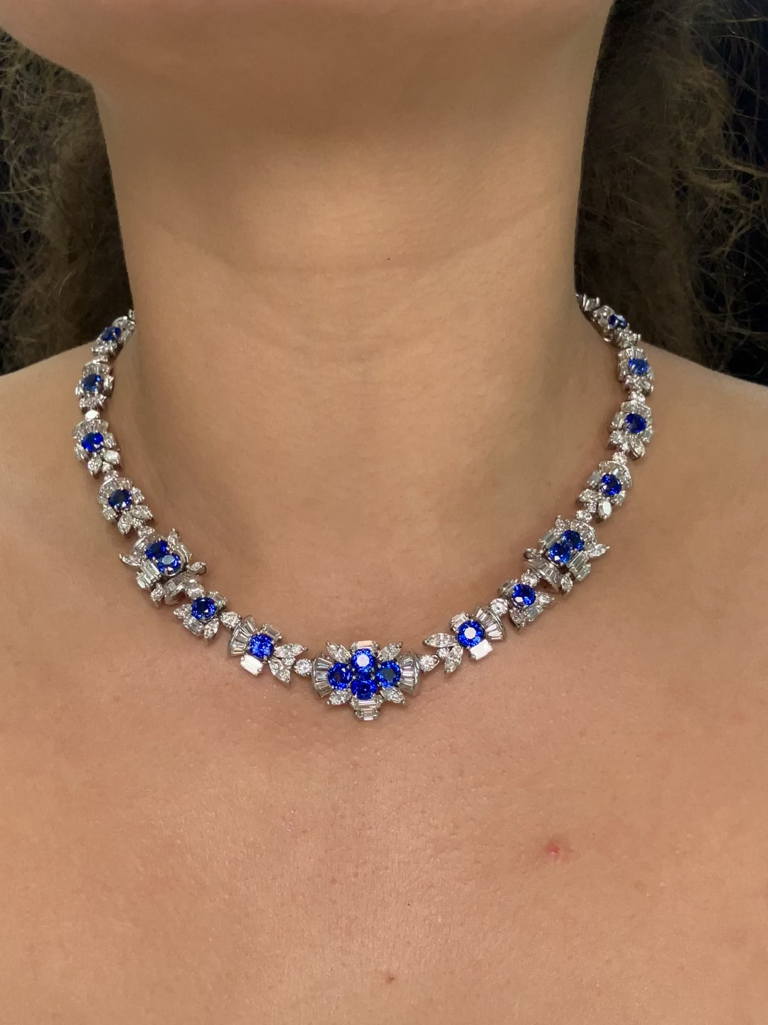 A vintage sapphire and diamond necklace that looks like each link is part of a flower at Forever Rox Fine Jewelry