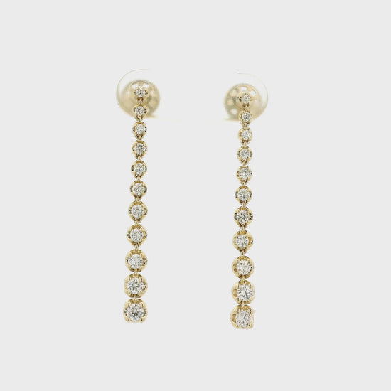 A Pair of Yellow Gold Dangle Earrings with graduating size bezel set round cut natural diamonds at Forever Rox Fine Jewelry, Lake Tahoes Best Jewelry Store