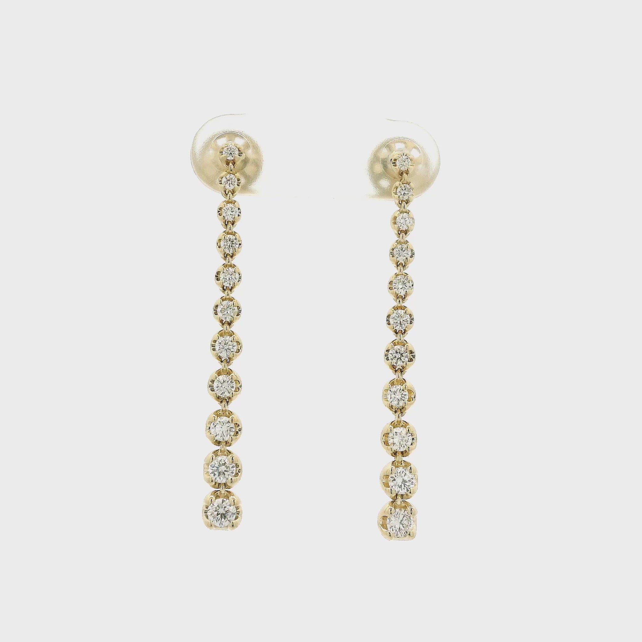 A Pair of Yellow Gold Dangle Earrings with graduating size bezel set round cut natural diamonds at Forever Rox Fine Jewelry, Lake Tahoes Best Jewelry Store
