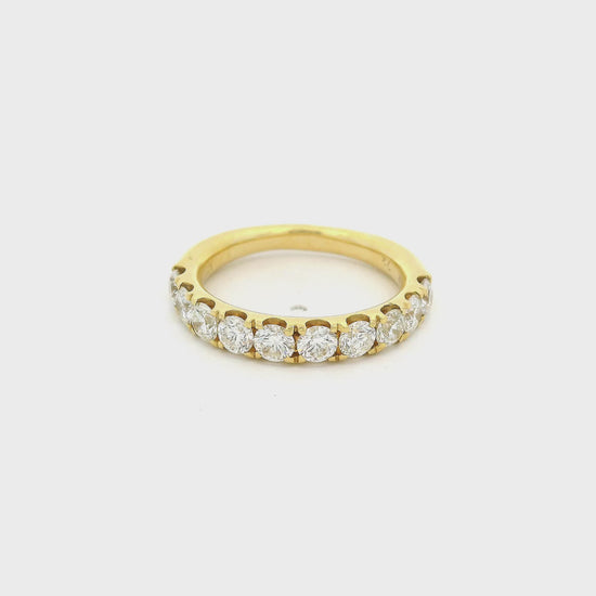 Yellow Gold band with diamonds set in prongs going halfway arounf the band at Forever Rox Fine Jewelry 