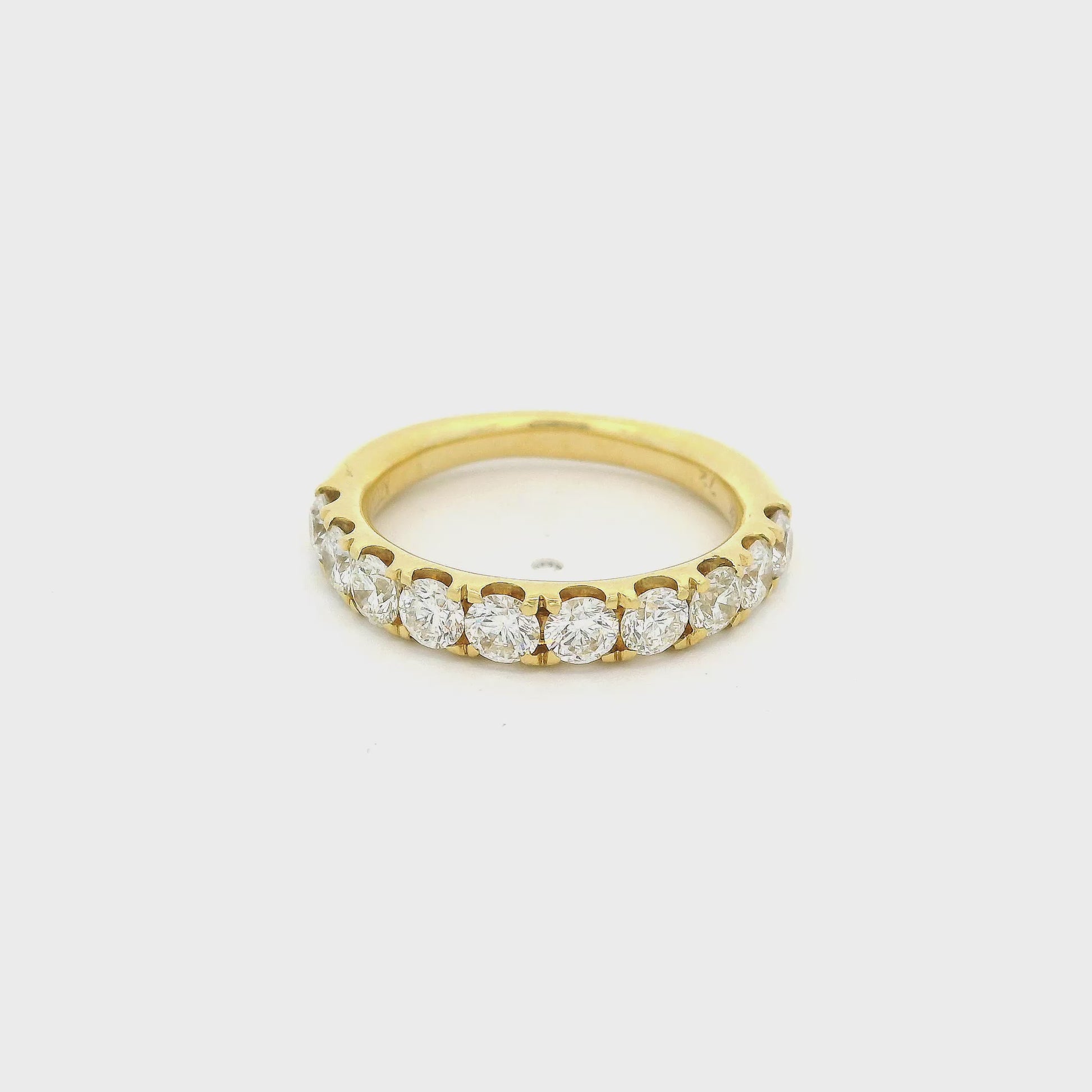 Yellow Gold band with diamonds set in prongs going halfway arounf the band at Forever Rox Fine Jewelry 