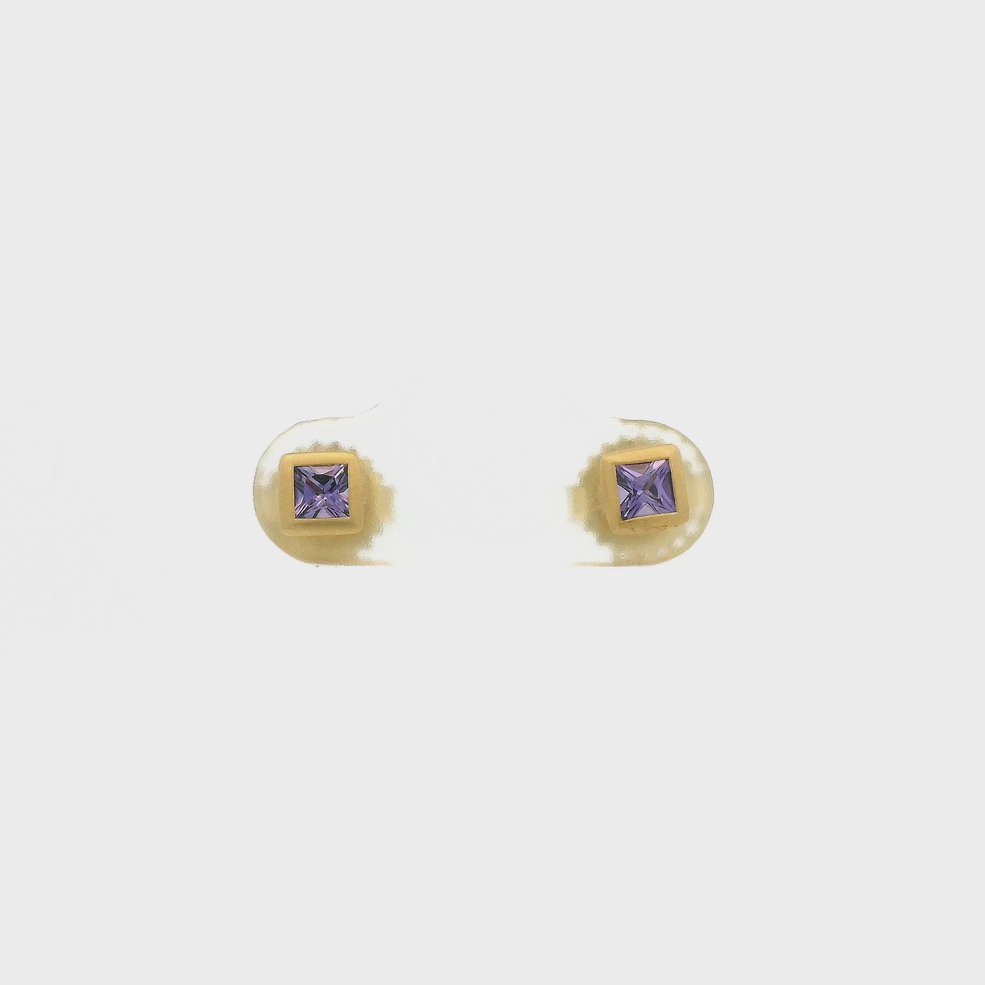 A Pair of Yellow Gold Stud Earrings with bezel set princess cut natural Purple Sapphire in the center at Forever Rox Fine Jewelry, Lake Tahoes Best Jewelry Store