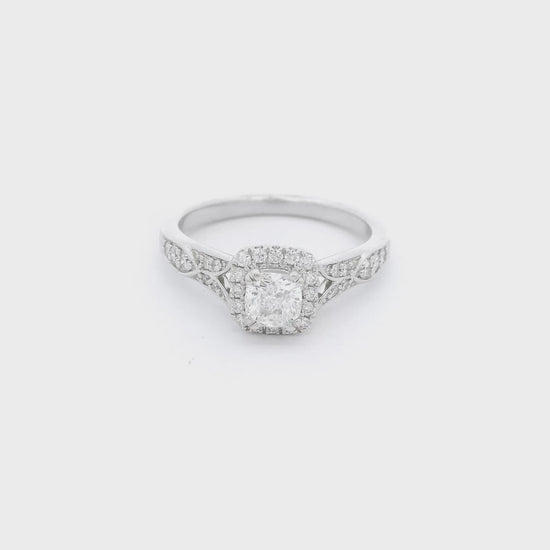 White gold ring with hand carved designs and diamonds with a diamond set in the center at Forever Rox Fine Jewelry
