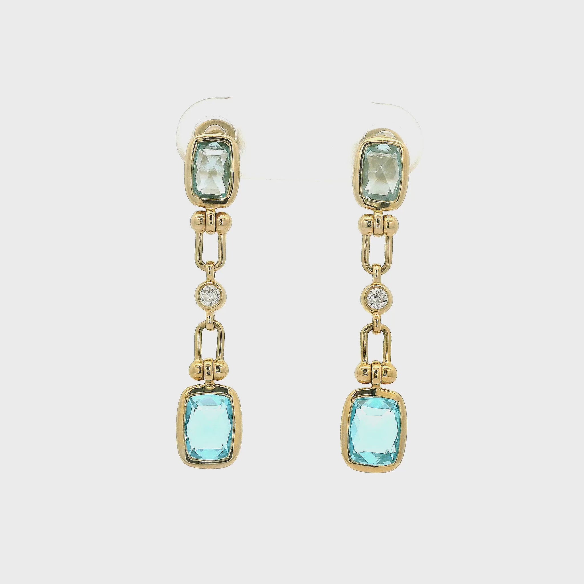 A Pair of Yellow Gold Dangle Earrings with bezel set cushion cut natural Swiis Blue Topaz & Blue Topaz and bezel set Diamonds at Forever Rox Fine Jewelry, Lake Tahoes Best Jewelry Store
