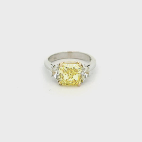 Two Tone Ring with a cushion cut fancy intense yellow diamond in the center and two half moon cut diamonds next to it at Forever Rox Fine Jewelry