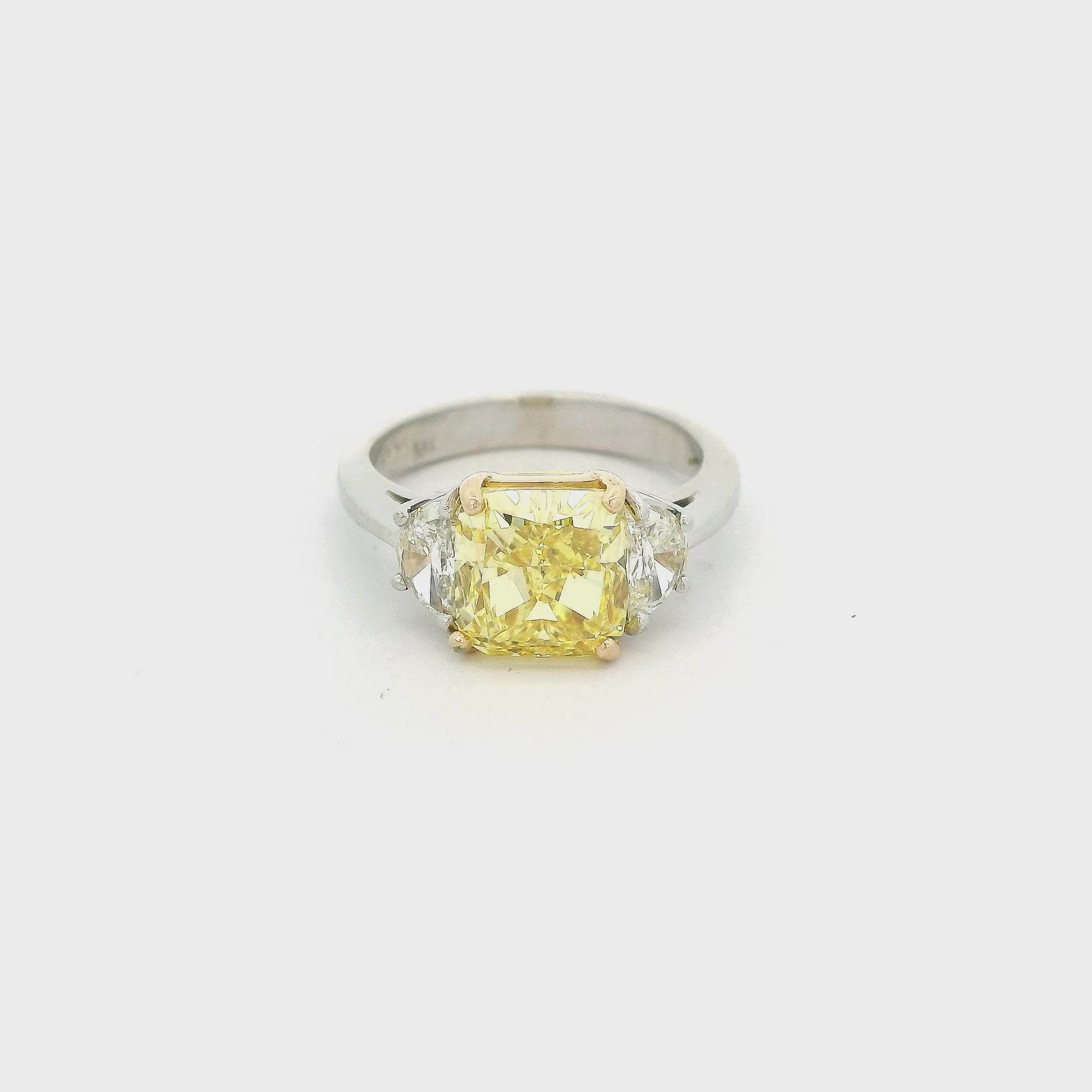 Two Tone Ring with a cushion cut fancy intense yellow diamond in the center and two half moon cut diamonds next to it at Forever Rox Fine Jewelry