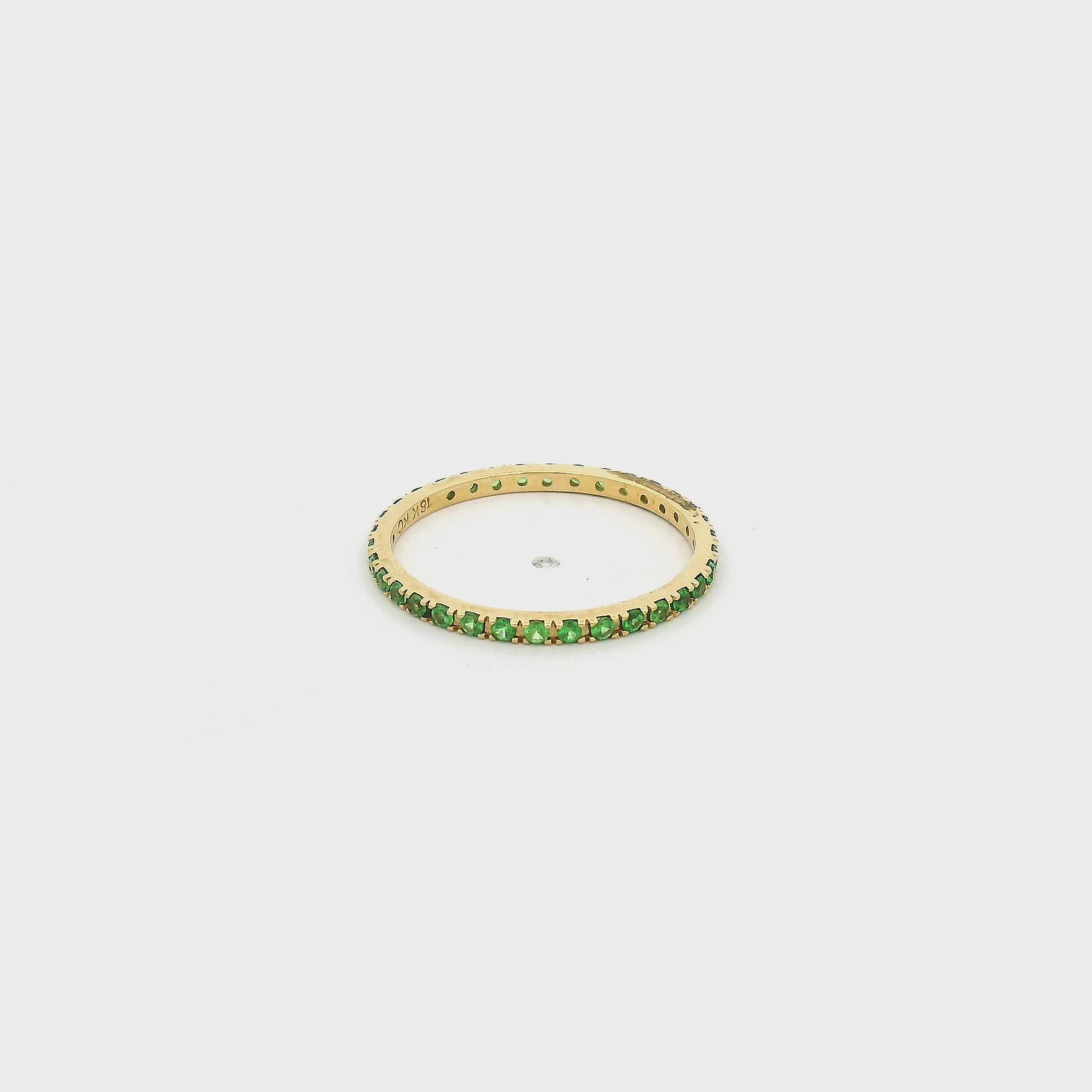 A Yellow Gold Eternity Band with Natrual Tsavorite Garnets at Forever Rox Fine Jewelry, Lake Tahoes Best Jewelry Store