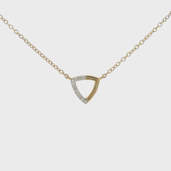 A Rose Gold Trianlge Shaped Pendant with Diamonds set in half of the pendant with a chain attached at Forever Rox Fine Jewelry, Lake Tahoes Best Jewelry Store
