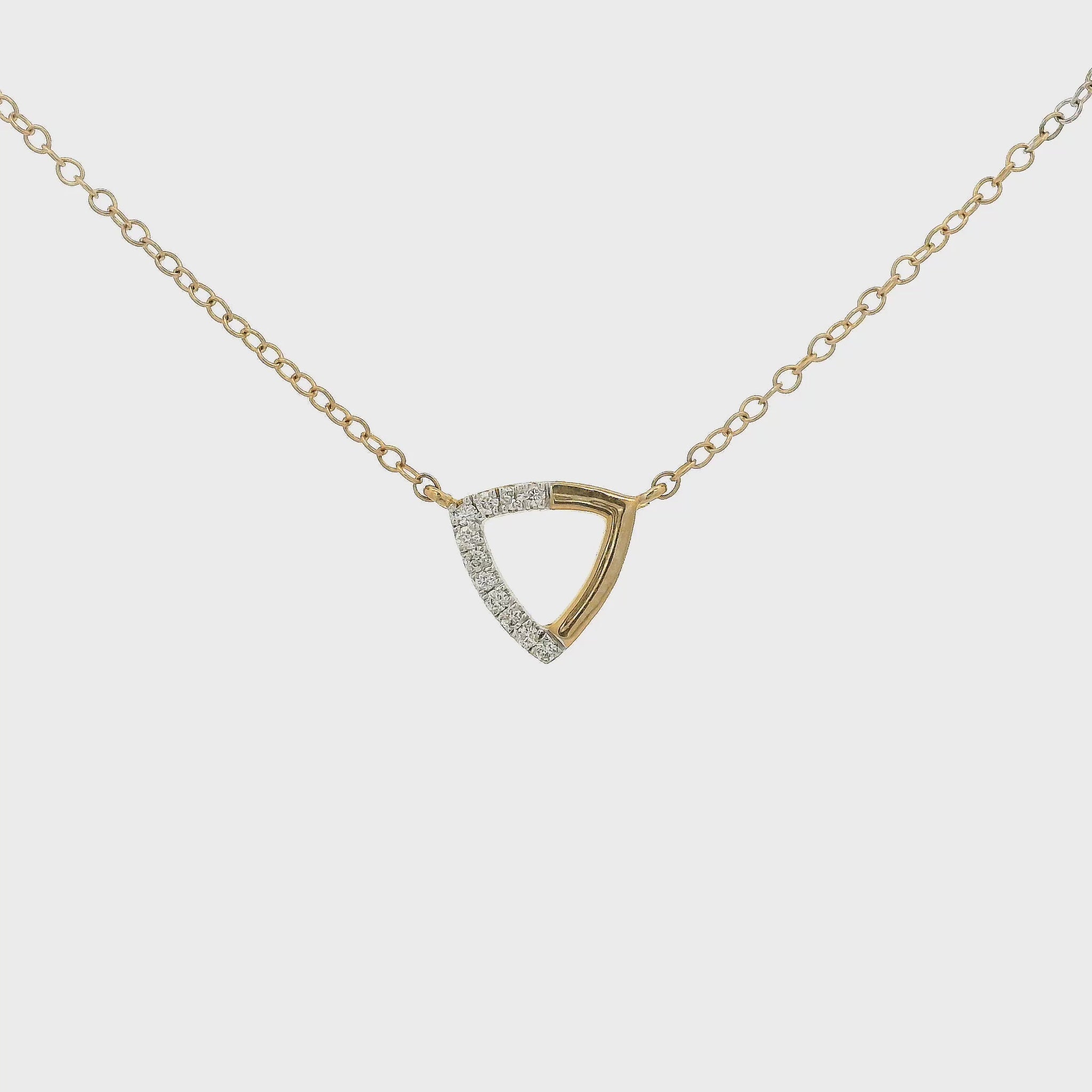 A Rose Gold Trianlge Shaped Pendant with Diamonds set in half of the pendant with a chain attached at Forever Rox Fine Jewelry, Lake Tahoes Best Jewelry Store
