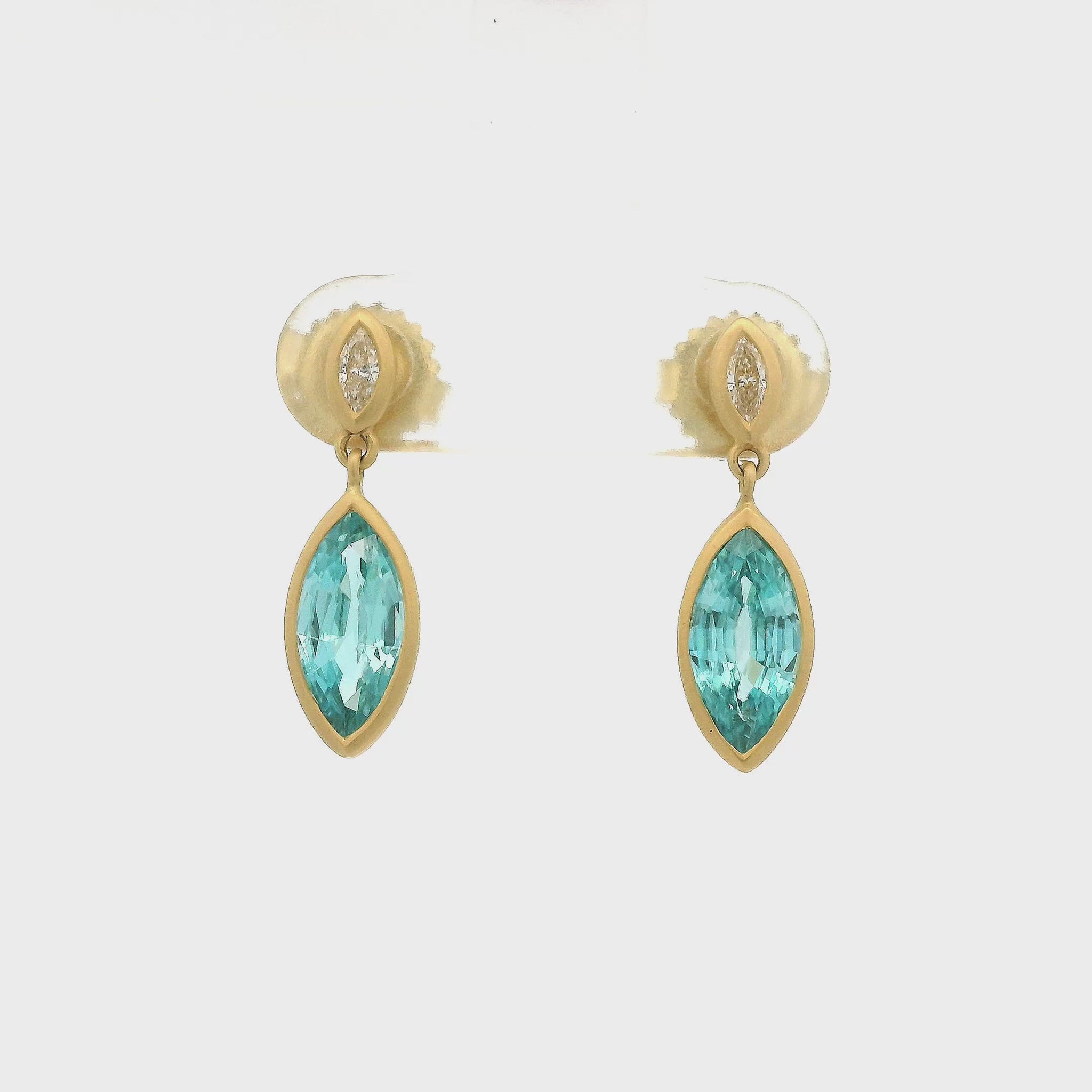 A Pair of Yellow Gold Dangle Earrings with bezel set marquise cut Blue Zircons and Diamonds at Lake Tahoes best Jewelry Store, Forever Rox Fine Jewelry