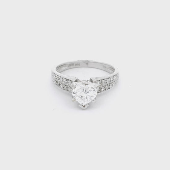 White Gold ring with a heart shape diamond in the center and tow rows of diamonds down each shank at Forever Rox Fine Jewelry