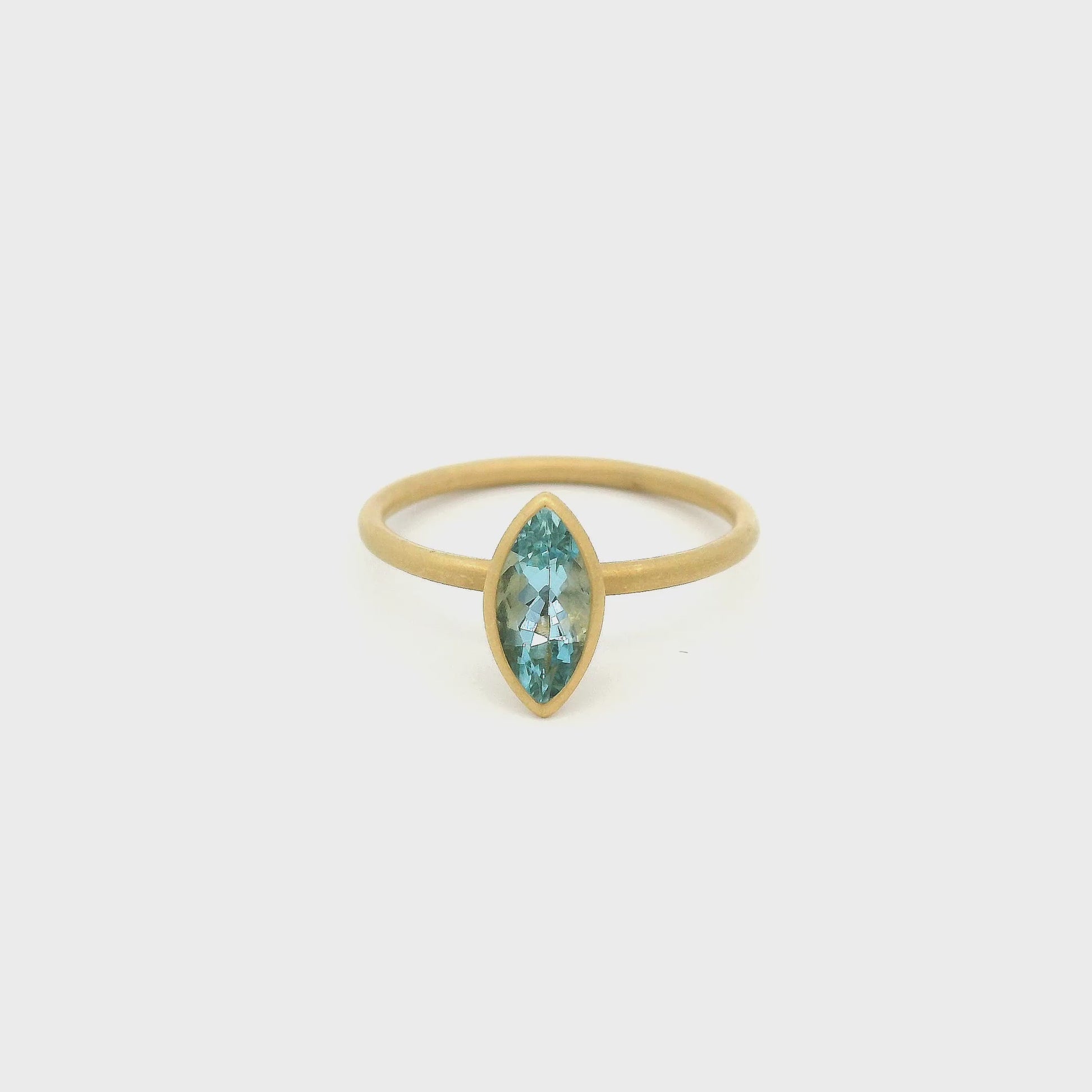 A Yellow Gold Ring with a solitaire bezel set marquise cut Aquamarine in the center at Forever Rox Fine Jewelry, Lake Tahoes Best Jewelry Store