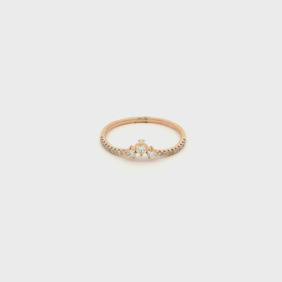 A Rose Gold Ring with 3 round cut natural Diamonds in the center with diamonds down each side of the shank at Forever Rox Fine Jewelry, Lake Tahoes Best Jewelry Store
