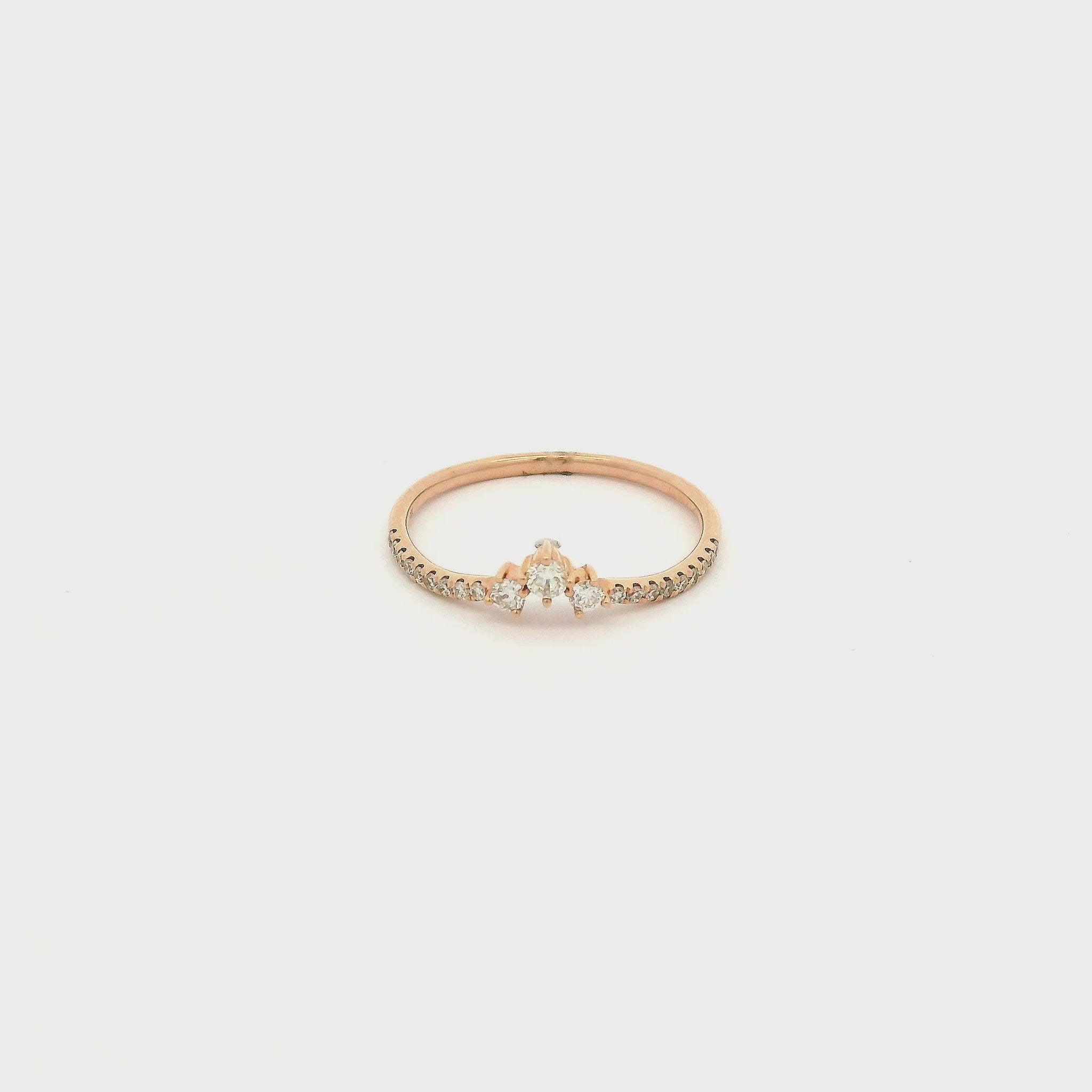 A Rose Gold Ring with 3 round cut natural Diamonds in the center with diamonds down each side of the shank at Forever Rox Fine Jewelry, Lake Tahoes Best Jewelry Store
