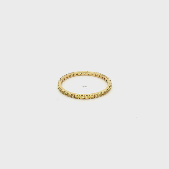 A Yellow Gold Eternity Band with natural Yellow Sapphires all the way around at Forever Rox Fine Jewelry, Lake Tahoes Best Jewelry Store