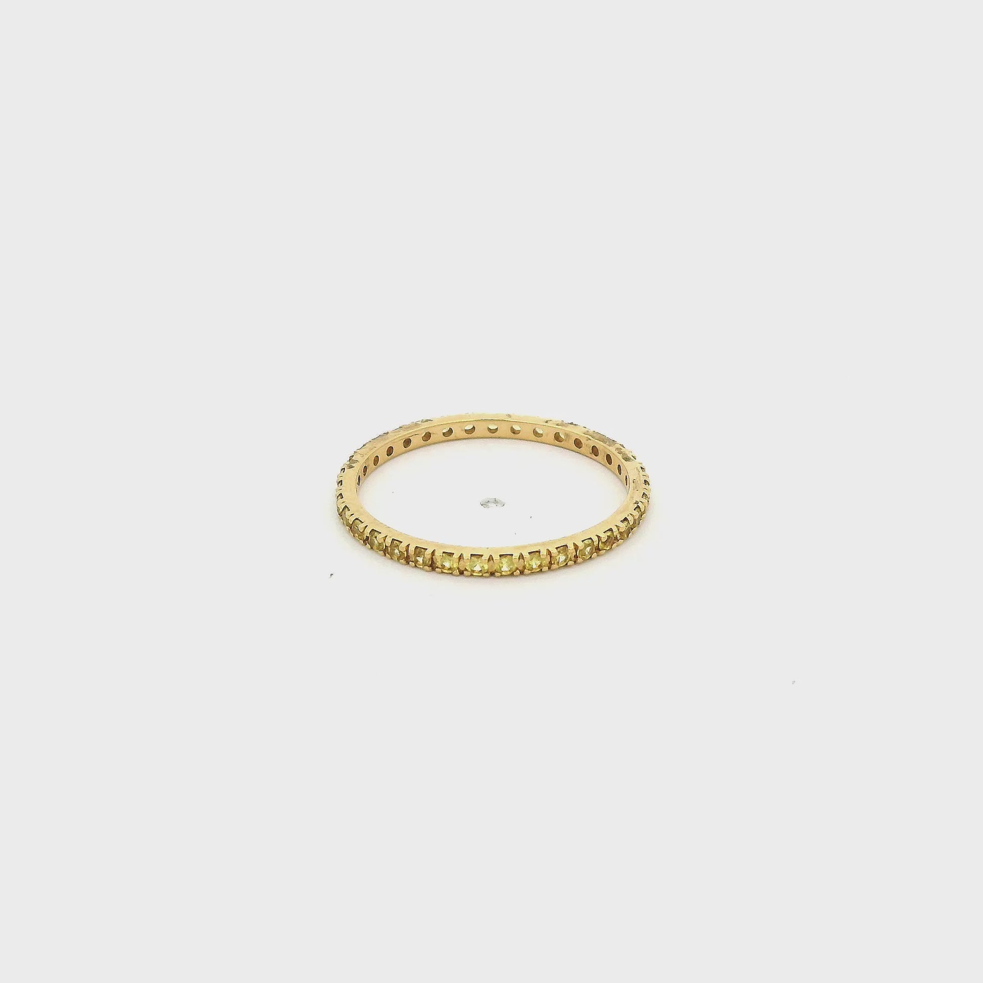 A Yellow Gold Eternity Band with natural Yellow Sapphires all the way around at Forever Rox Fine Jewelry, Lake Tahoes Best Jewelry Store