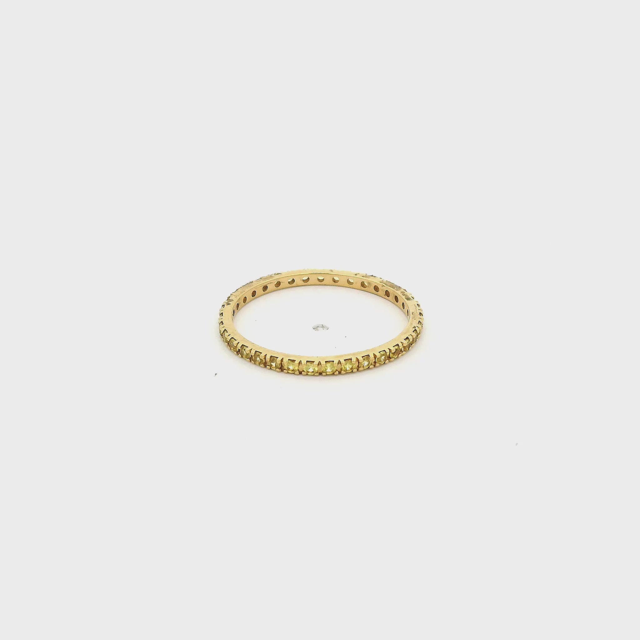 A Yellow Gold Eternity Band with natural Yellow Sapphires all the way around at Forever Rox Fine Jewelry, Lake Tahoes Best Jewelry Store