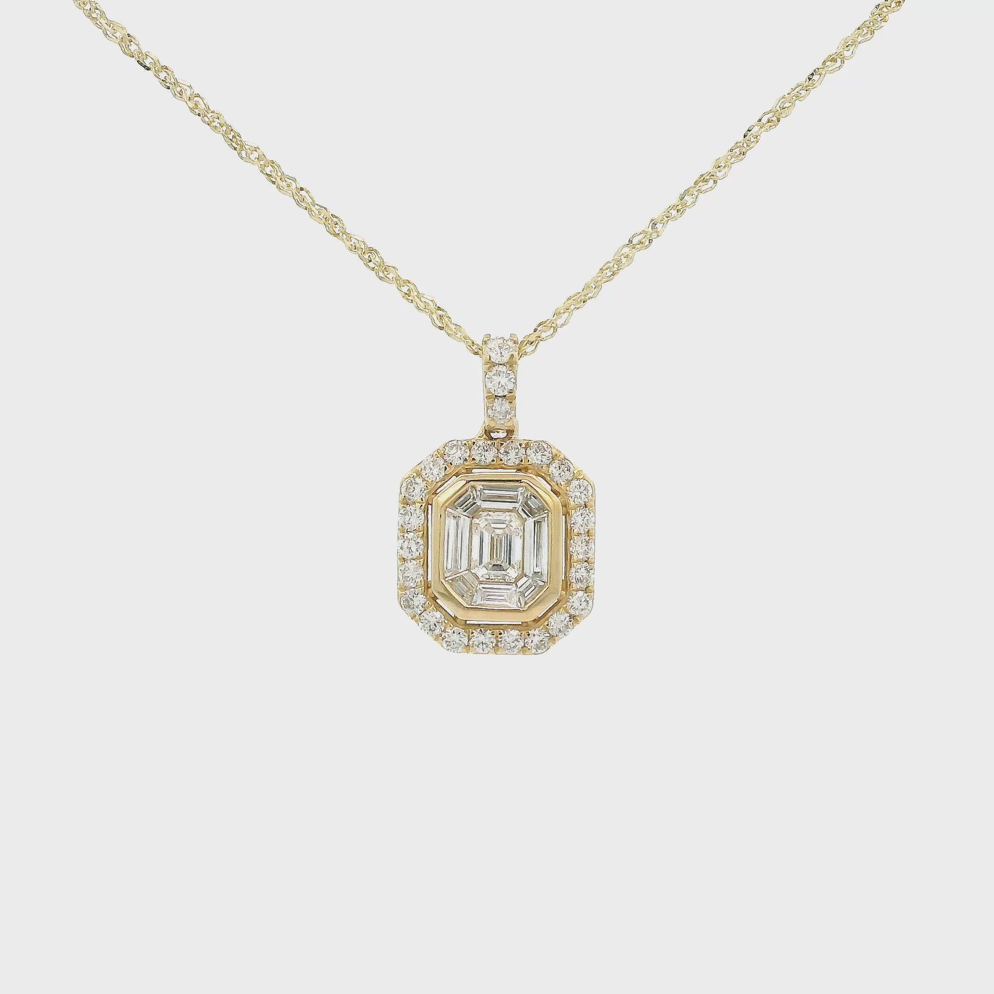 A Yellow Gold Octagon Shaped Pendant with bezel set baguette cut Diamonds in the center with a halo of round cut diamonds and round cut diamonds up the bail at Forever Rox Fine Jewelry, Lake Tahoes Best Jewelry Store
