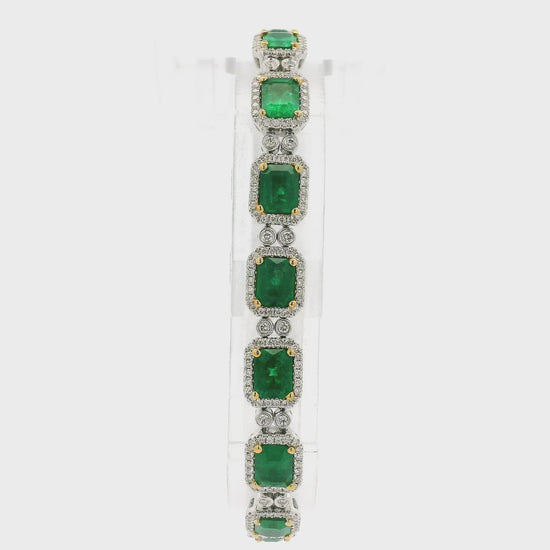 A White Gold Bracelet with prong set emerald cut natural Emeralds in the center with a diamond halo and diamonds between each link at Forever Rox Fine Jewelry, Lake Tahoes Best Jewelry Store