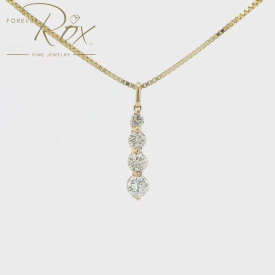 This custom pendant features four round brilliant-cut diamonds arranged in a graceful graduating design, creating a beautiful flow of sparkle from top to bottom. Expertly set in 14k yellow gold, the pendant combines timeless elegance with everyday wearability, allowing each diamond to shine while showcasing the warmth of the gold.
