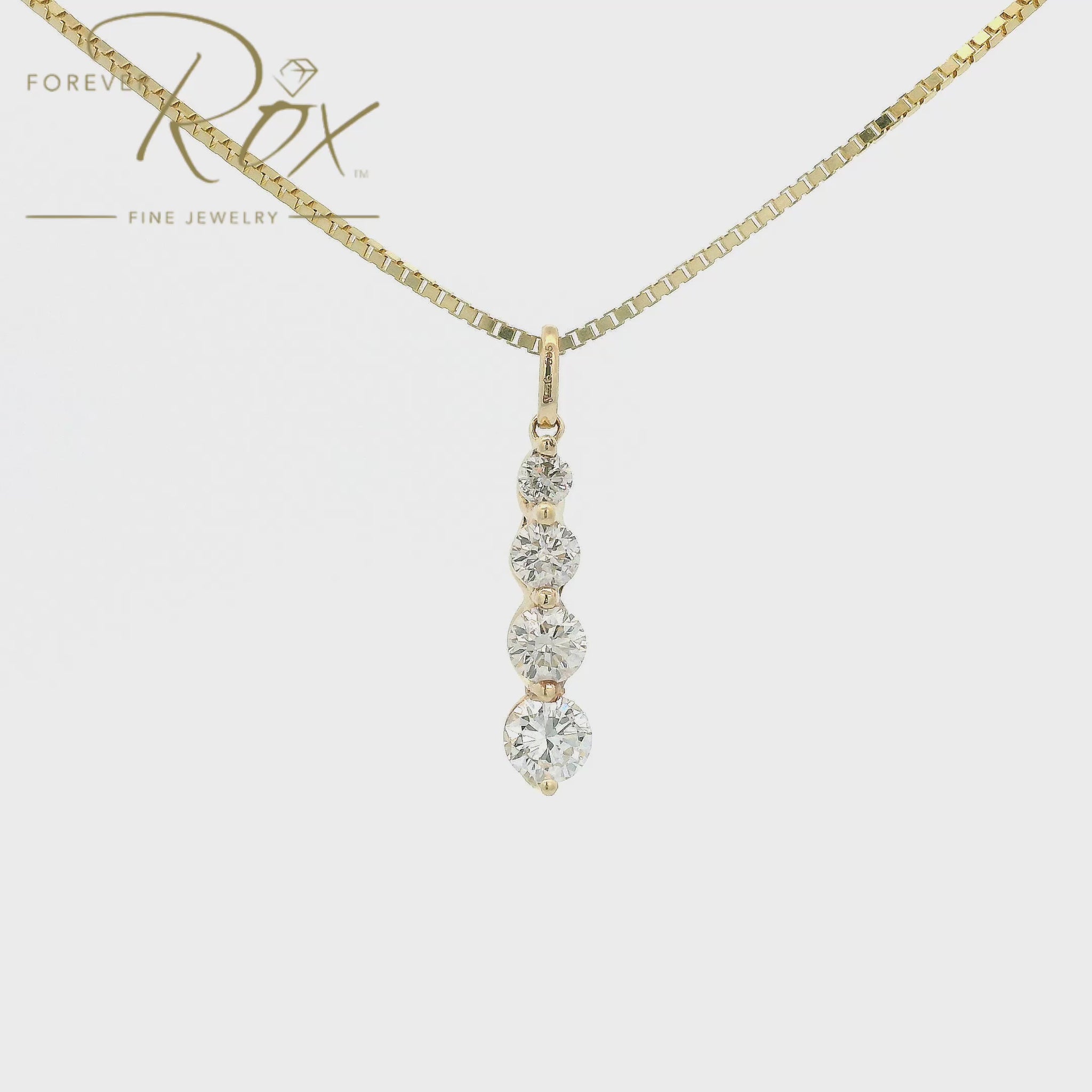 This custom pendant features four round brilliant-cut diamonds arranged in a graceful graduating design, creating a beautiful flow of sparkle from top to bottom. Expertly set in 14k yellow gold, the pendant combines timeless elegance with everyday wearability, allowing each diamond to shine while showcasing the warmth of the gold.