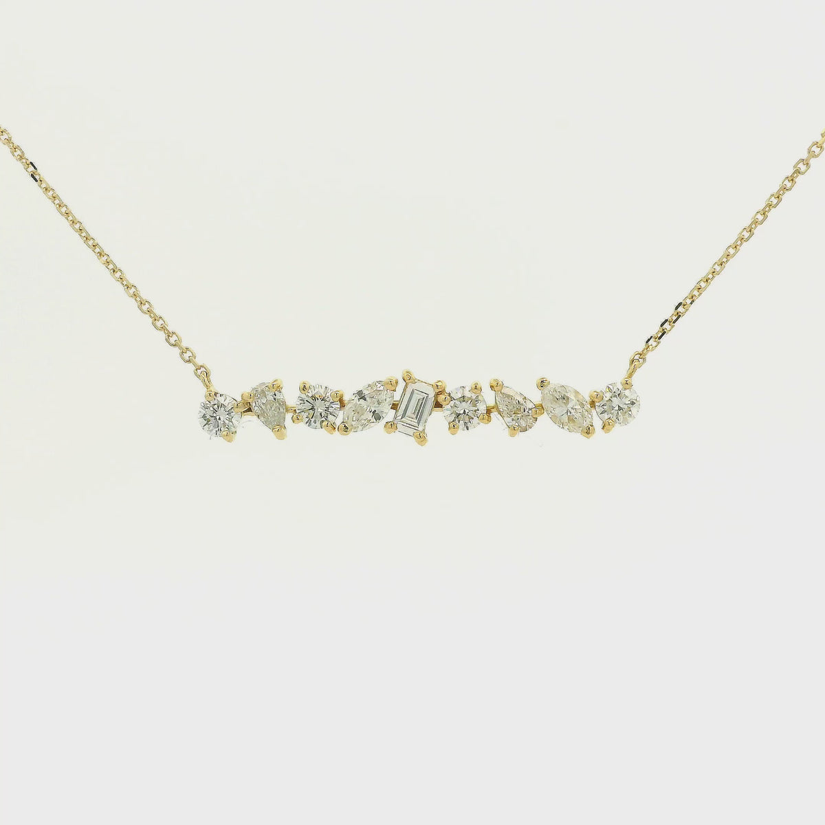 A Yellow Gold Bar Pendant with round, pear, marquise & emerald cut Diamonds at Forever Rox Fine Jewelry, Lake Tahoes Best Jewelry Store
