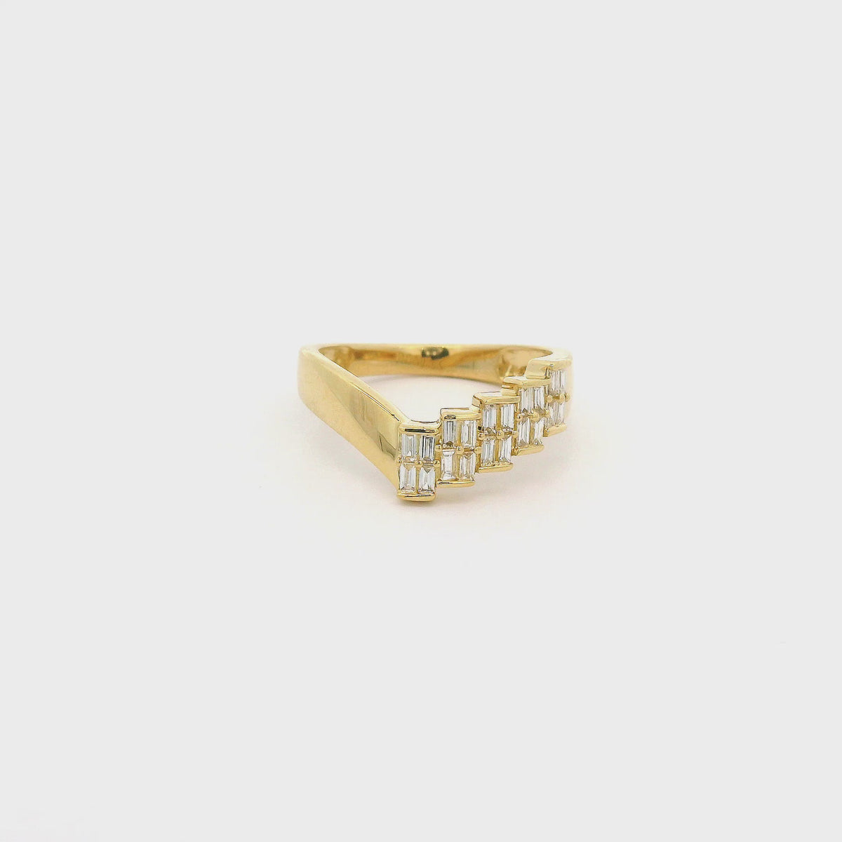 A Yellow Gold Ring withhalf of the ring set with bagguette cut diamonds in step form at Forever Rox Fine Jewelry, Lake Tahoes Best Jewelry Store
